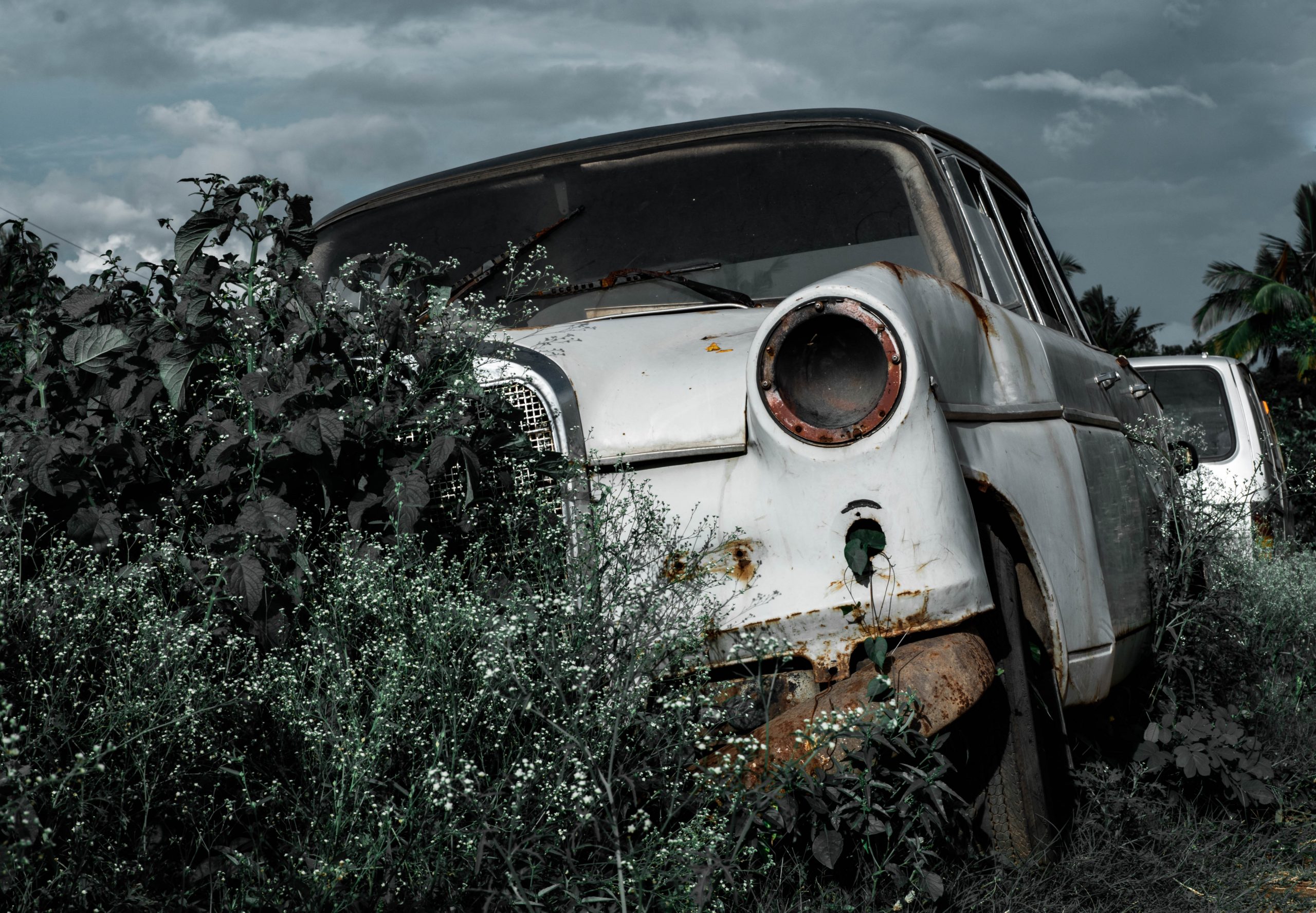 A rusted vintage car.