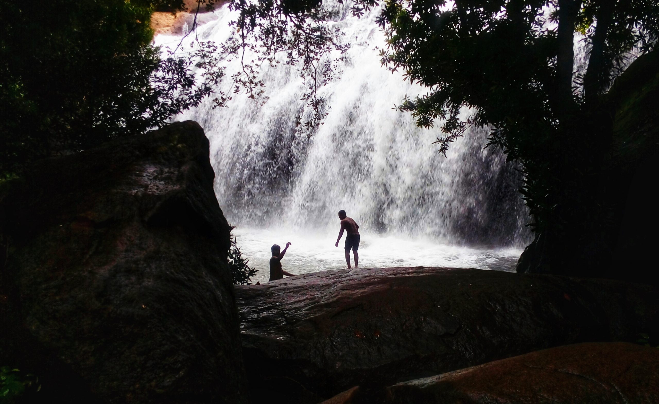 boys enjoyng in the waterfalls