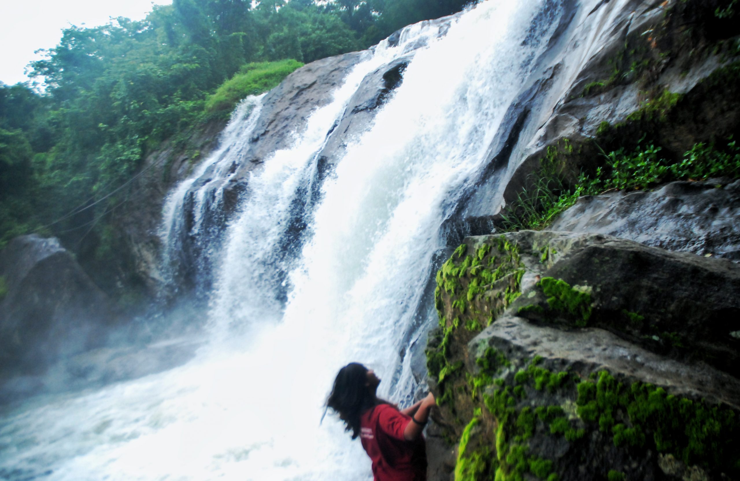 girl enjoying at waterfalls