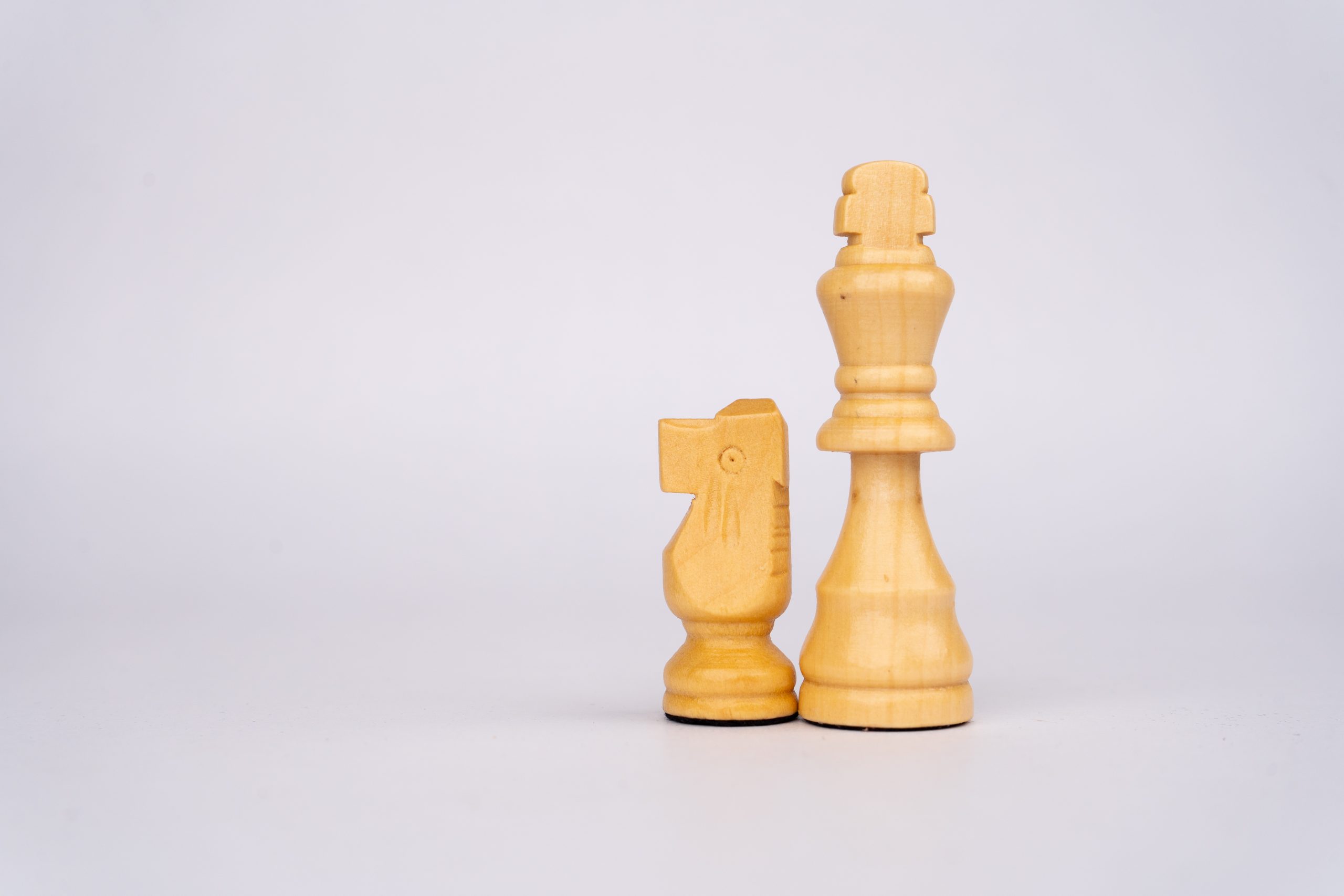 chess king and knight pegs