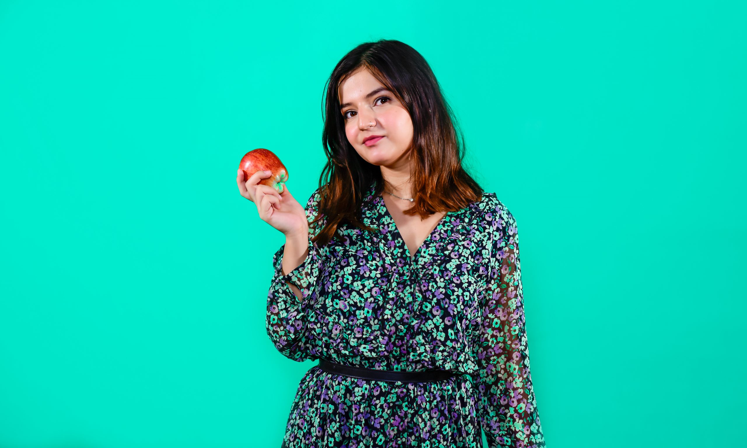 A Girl with Red Apple in Colour Background