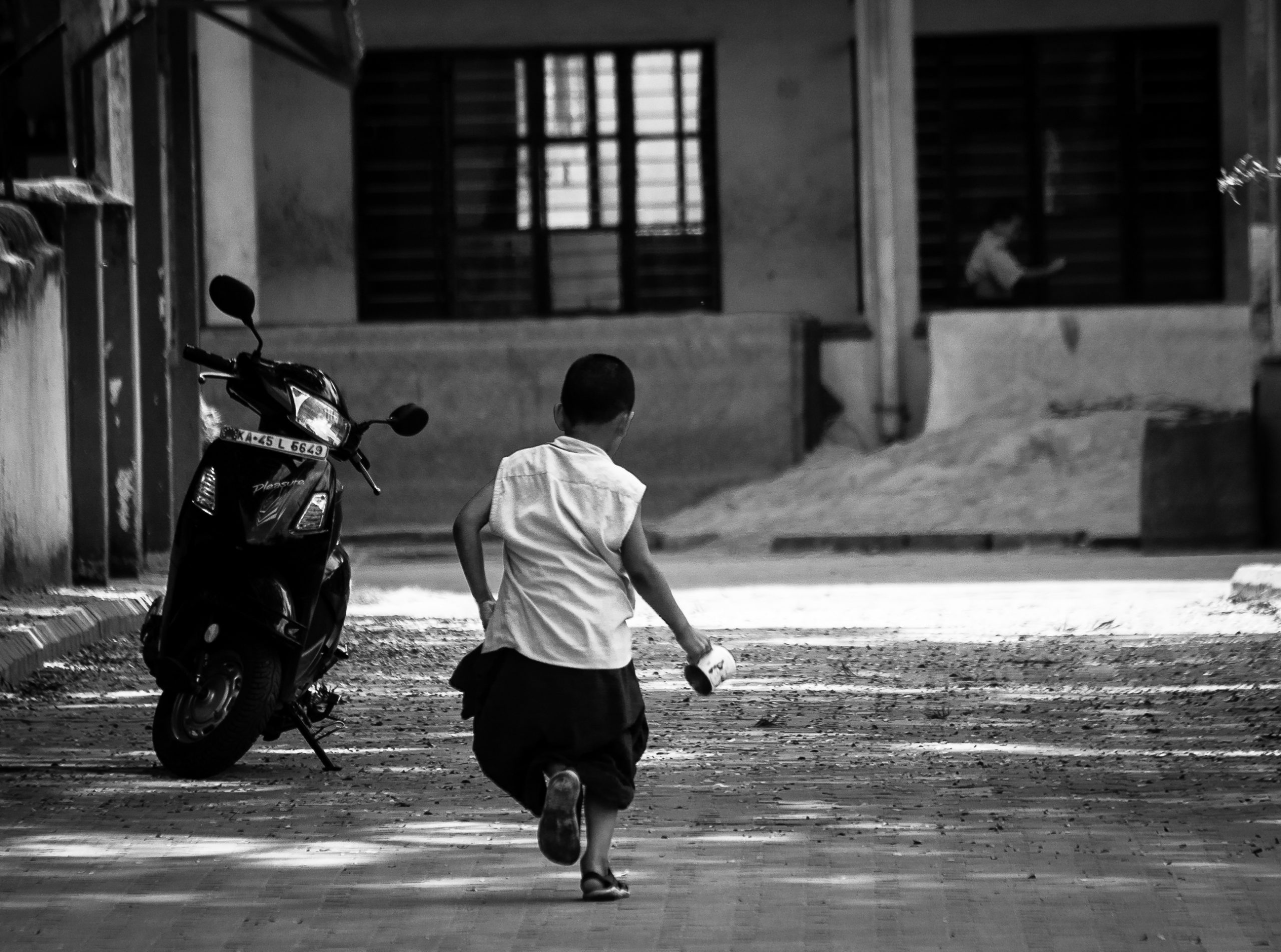 A boy playing in a street