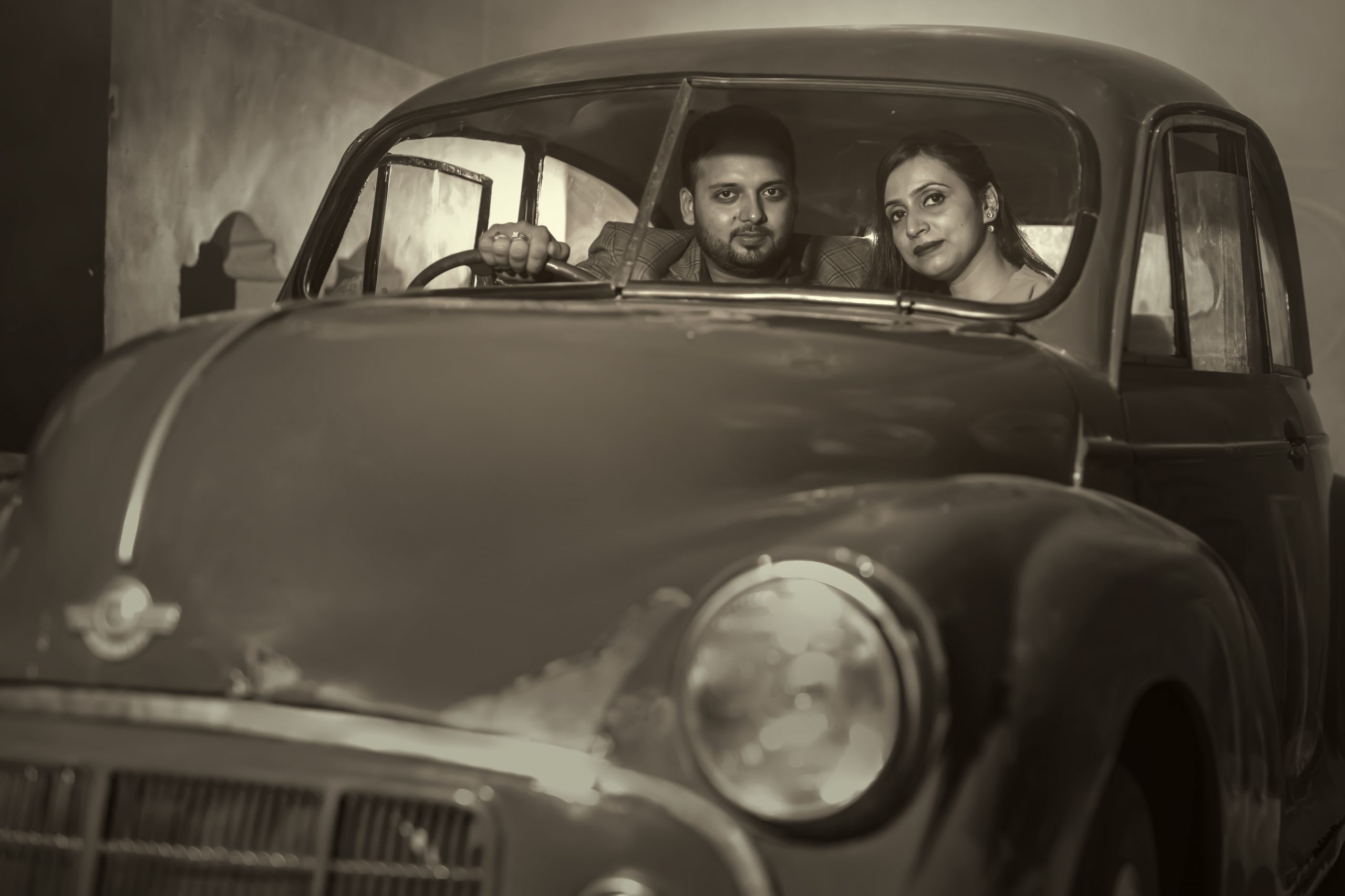 A couple in a vintage car