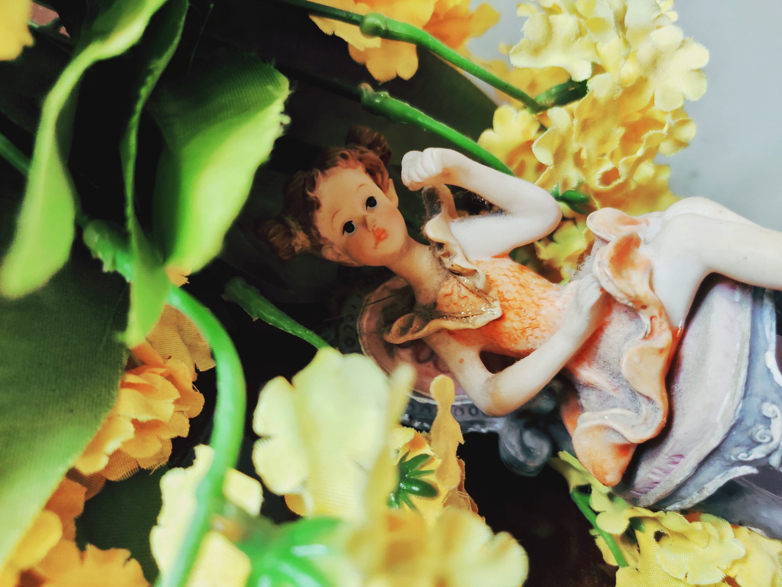 A doll in flowers