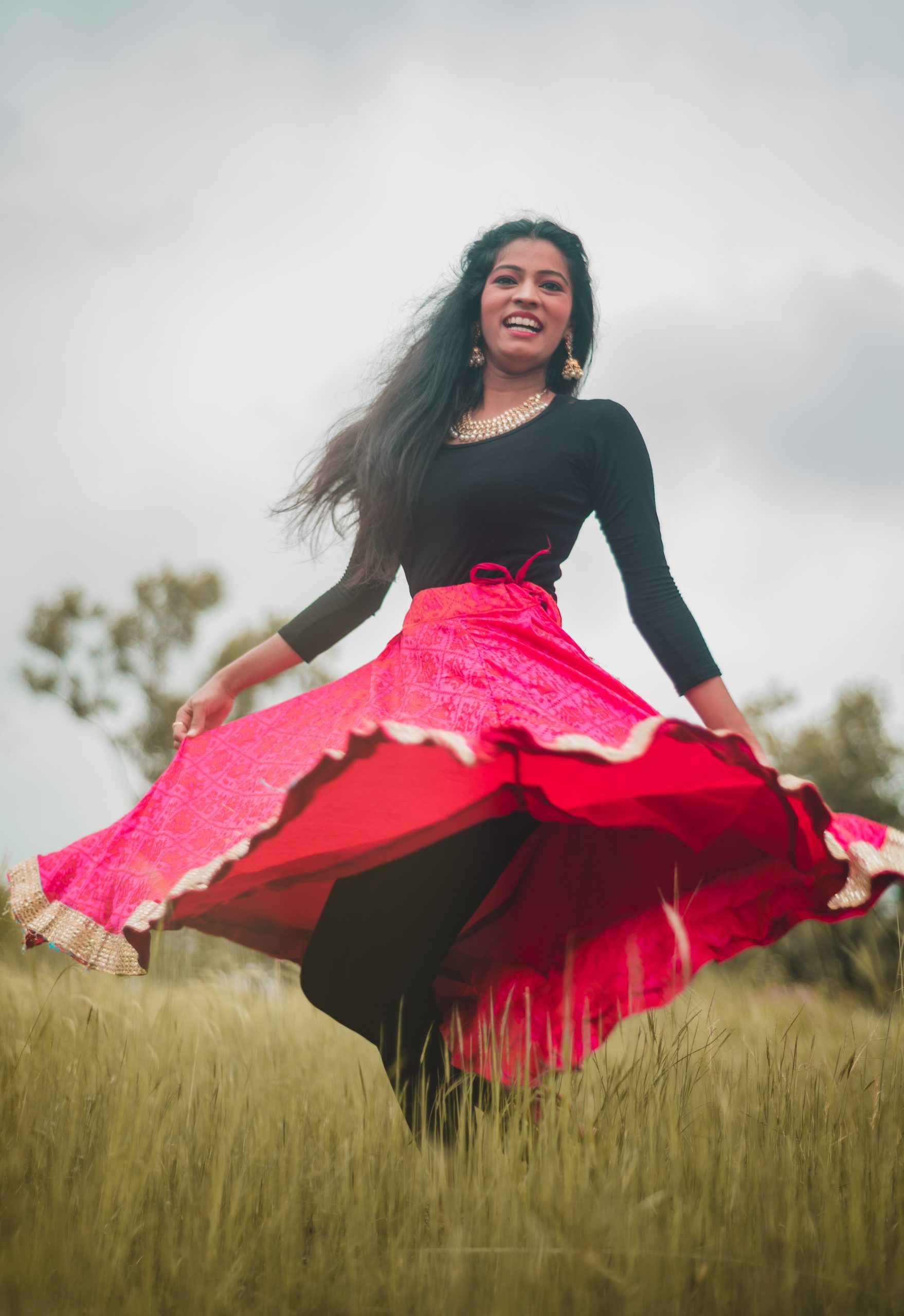 A girl dancing in grass