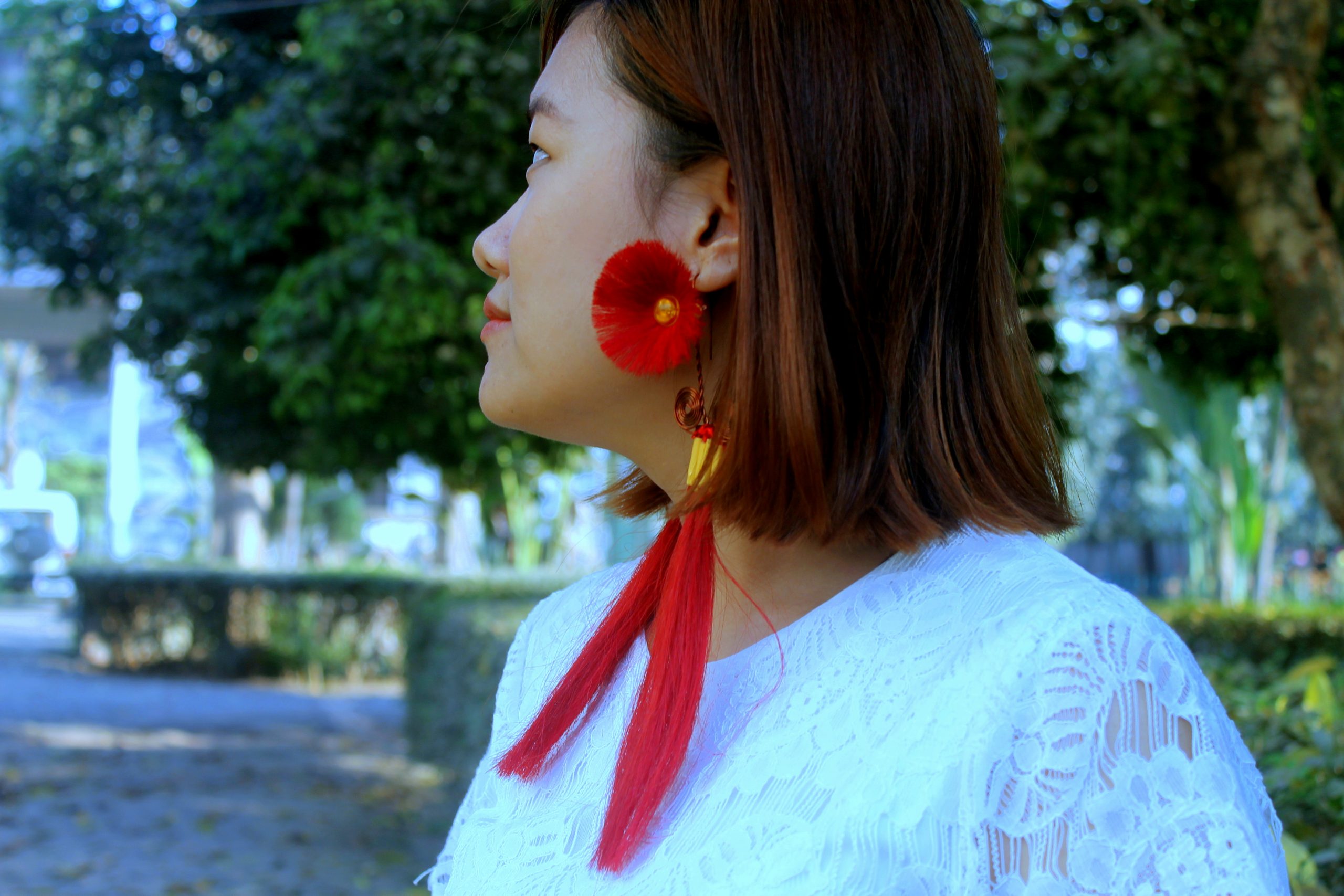 A girl with floral earrings