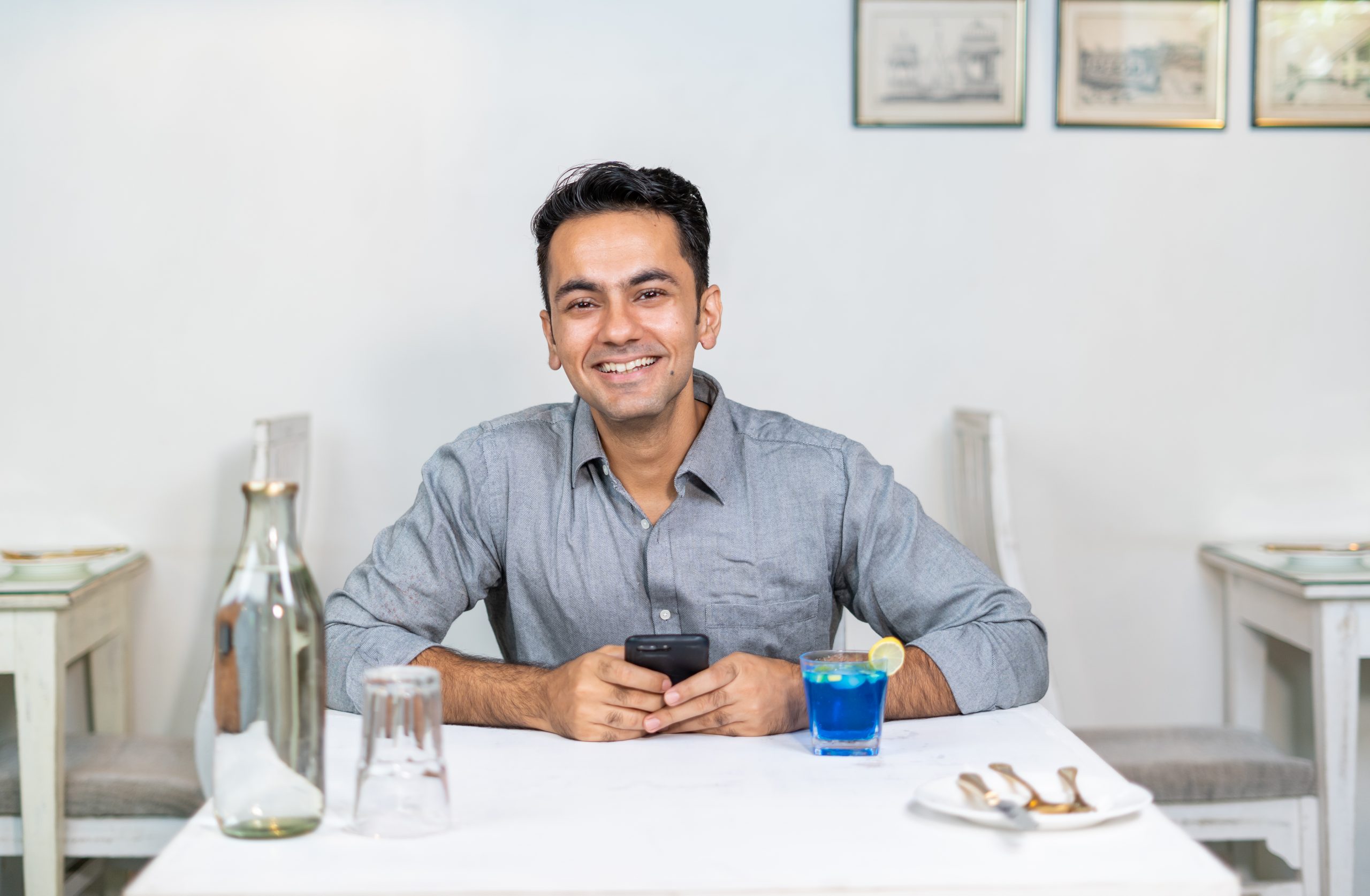 A happy young man smiling at the camera