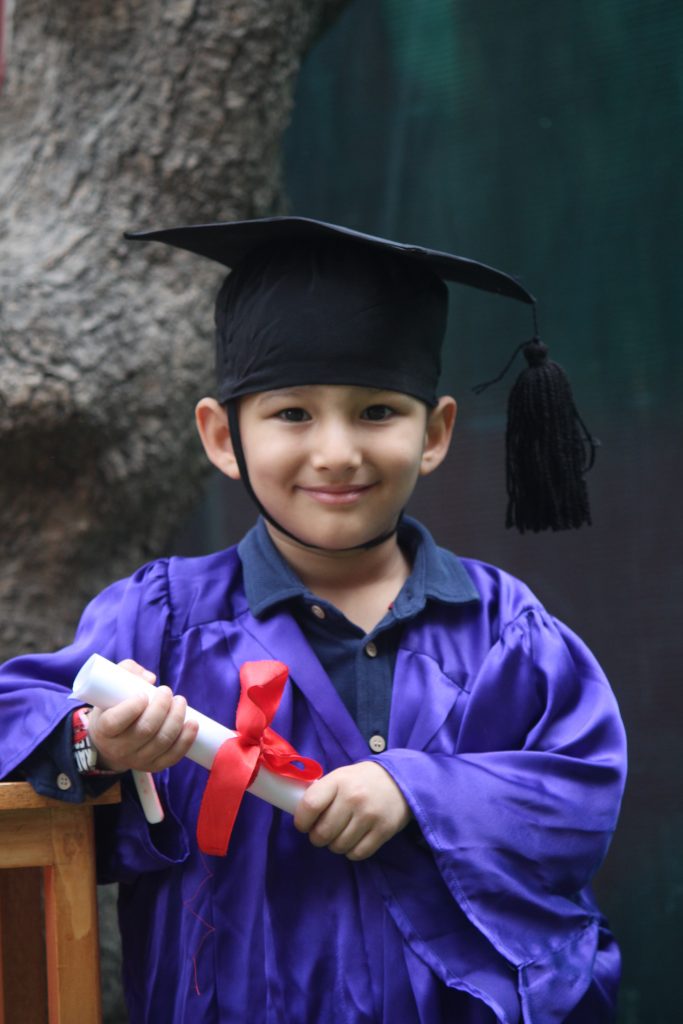 A kid in graduation gown - PixaHive
