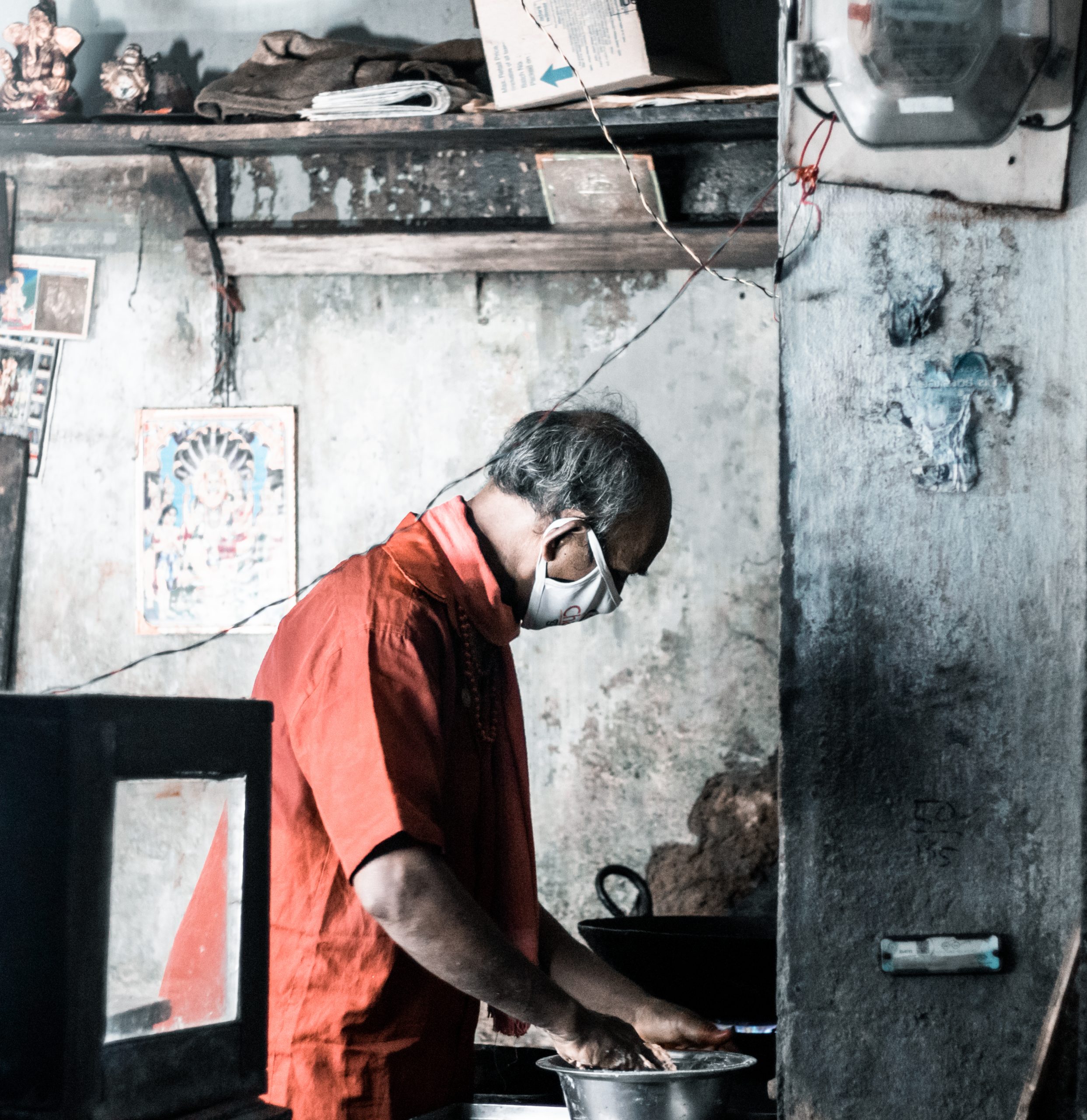 A man cooking in his shop