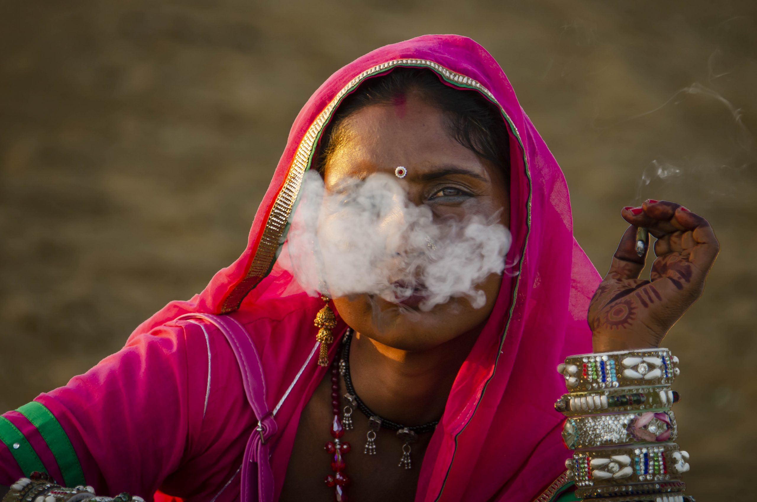 A tribal woman smoking