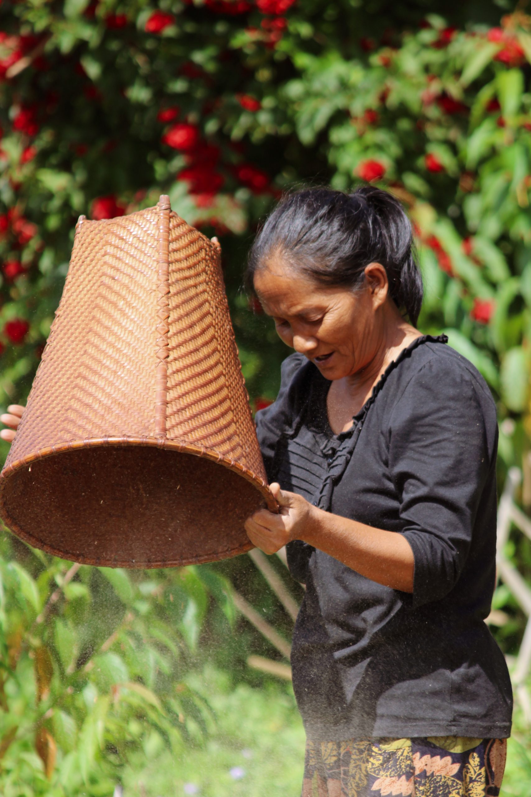 A woman holding bamboo basket