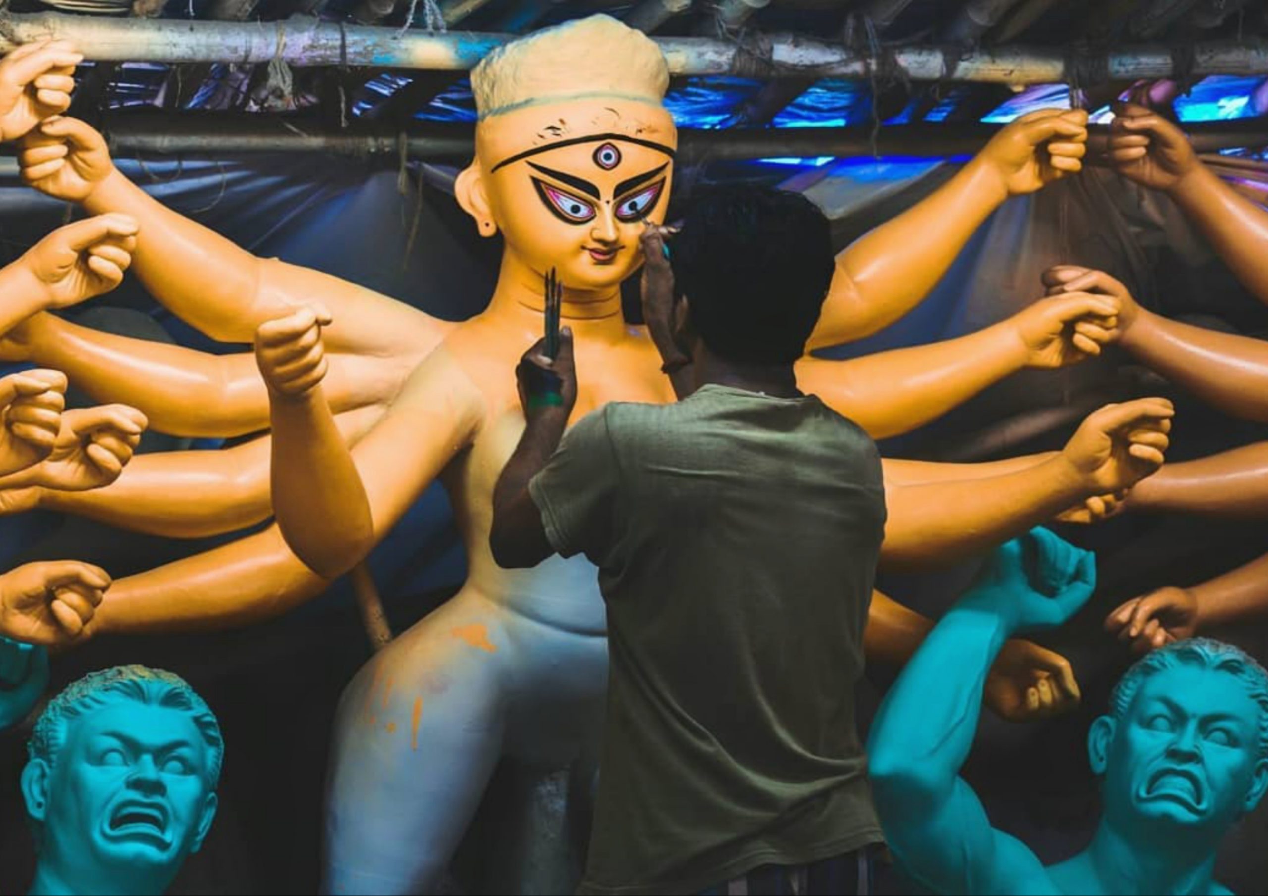 An artist painting Goddess statue