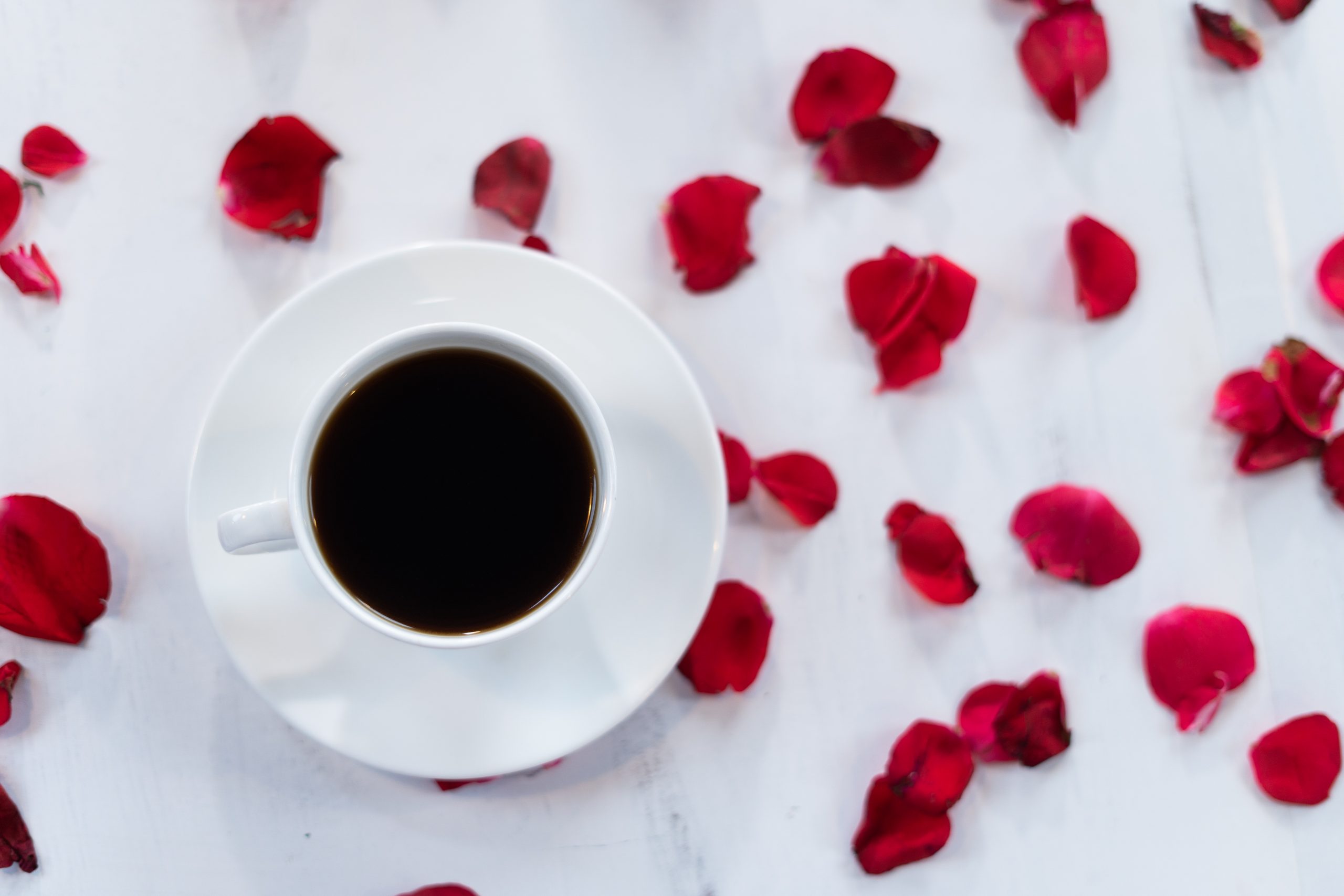 Coffee on flower petal background