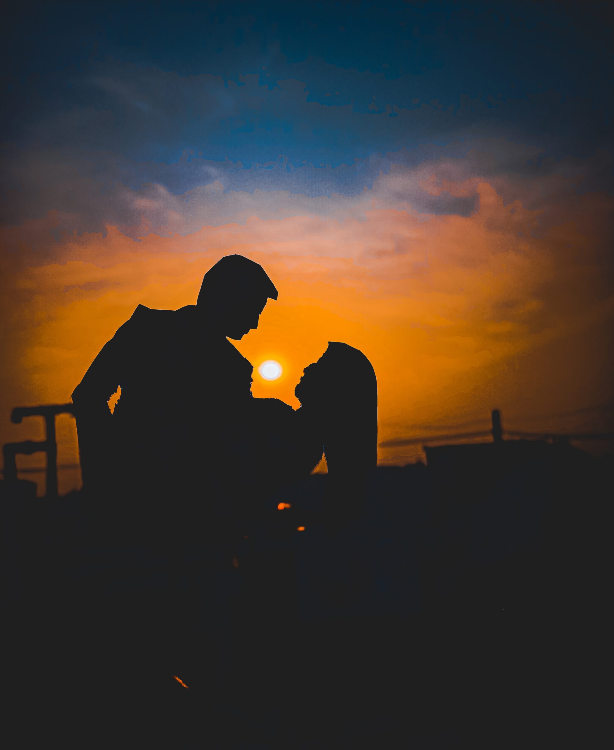 silhouette of couple against sunlight