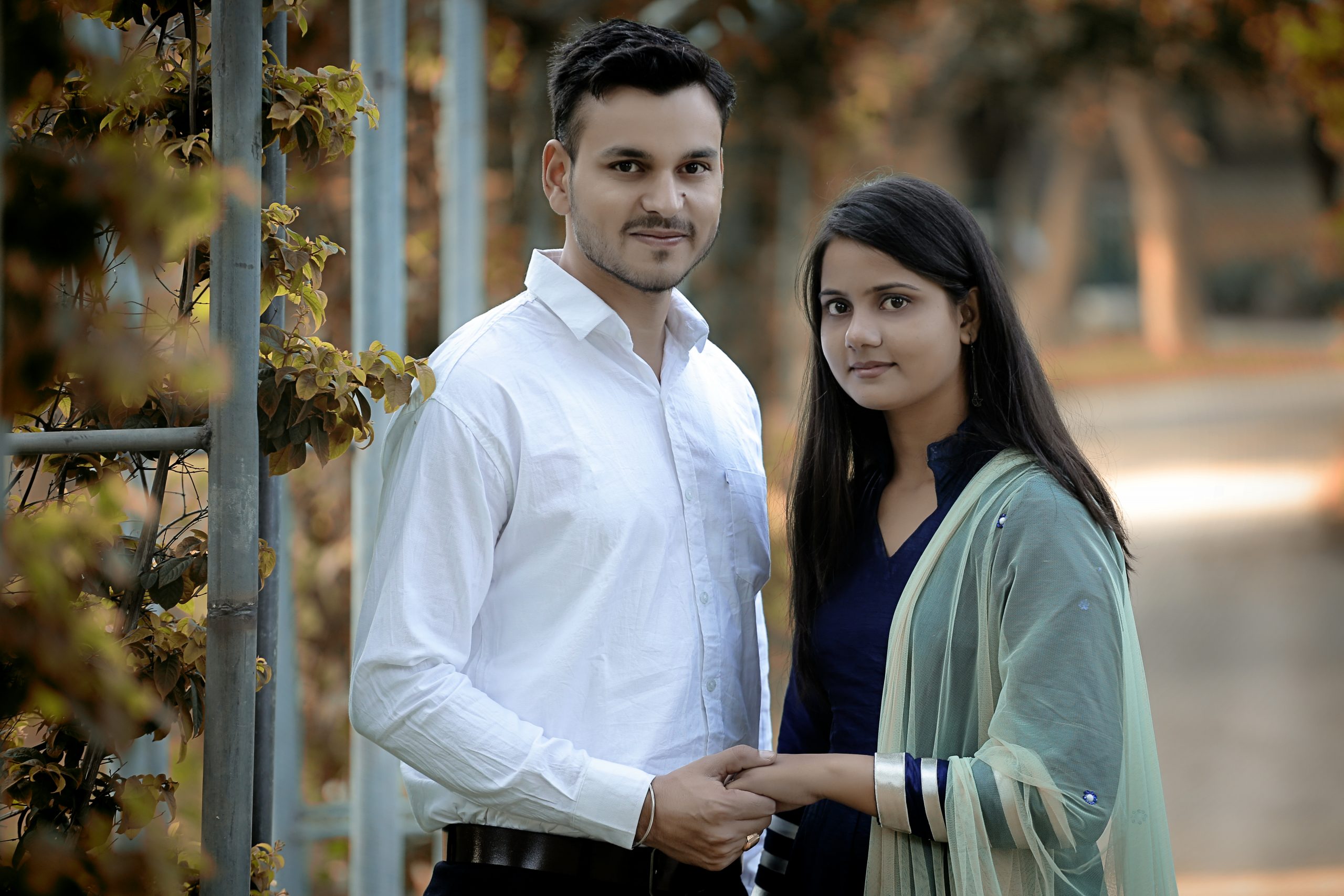 Couple holding hands landscape