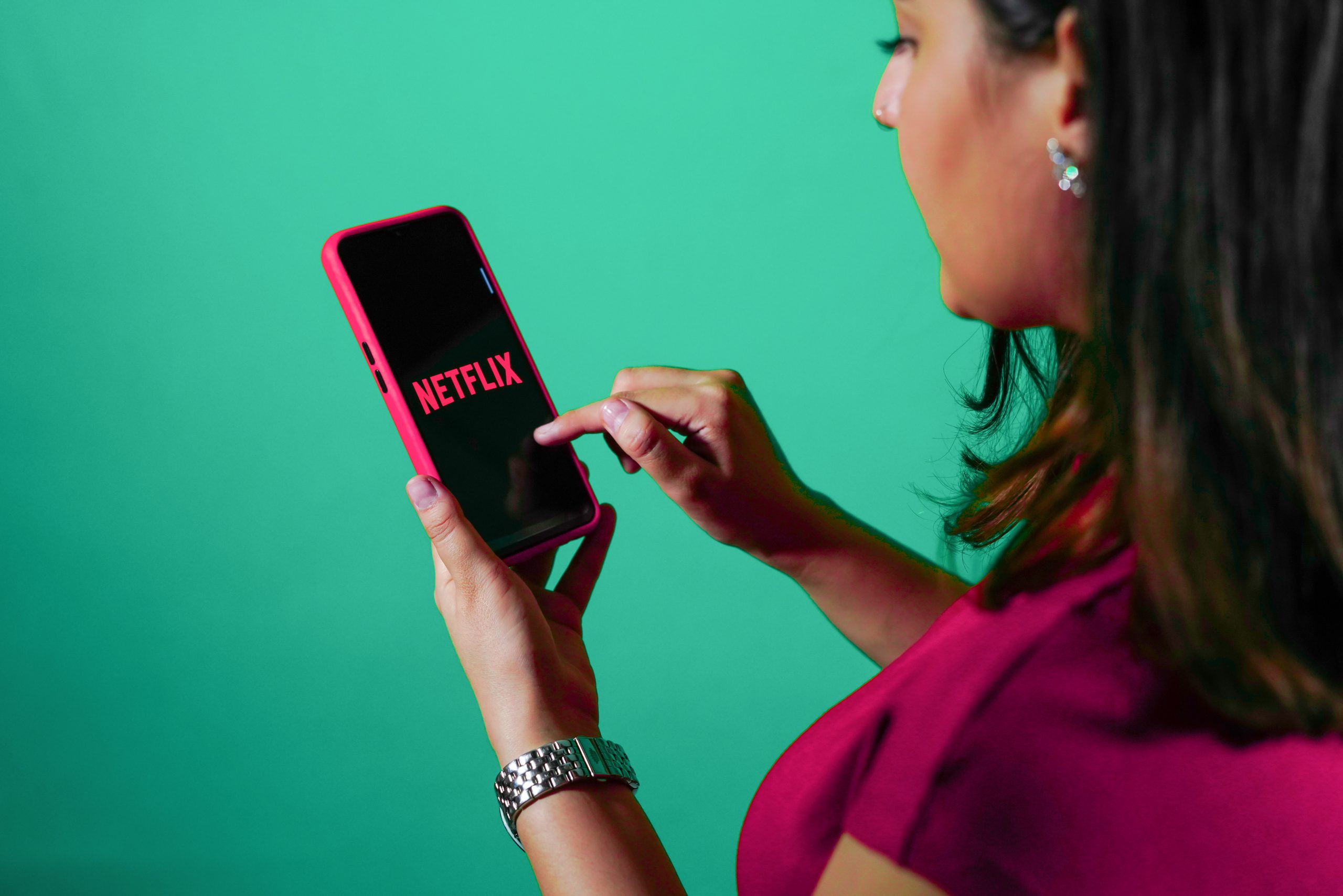 Girl watching Netflix on Smartphone