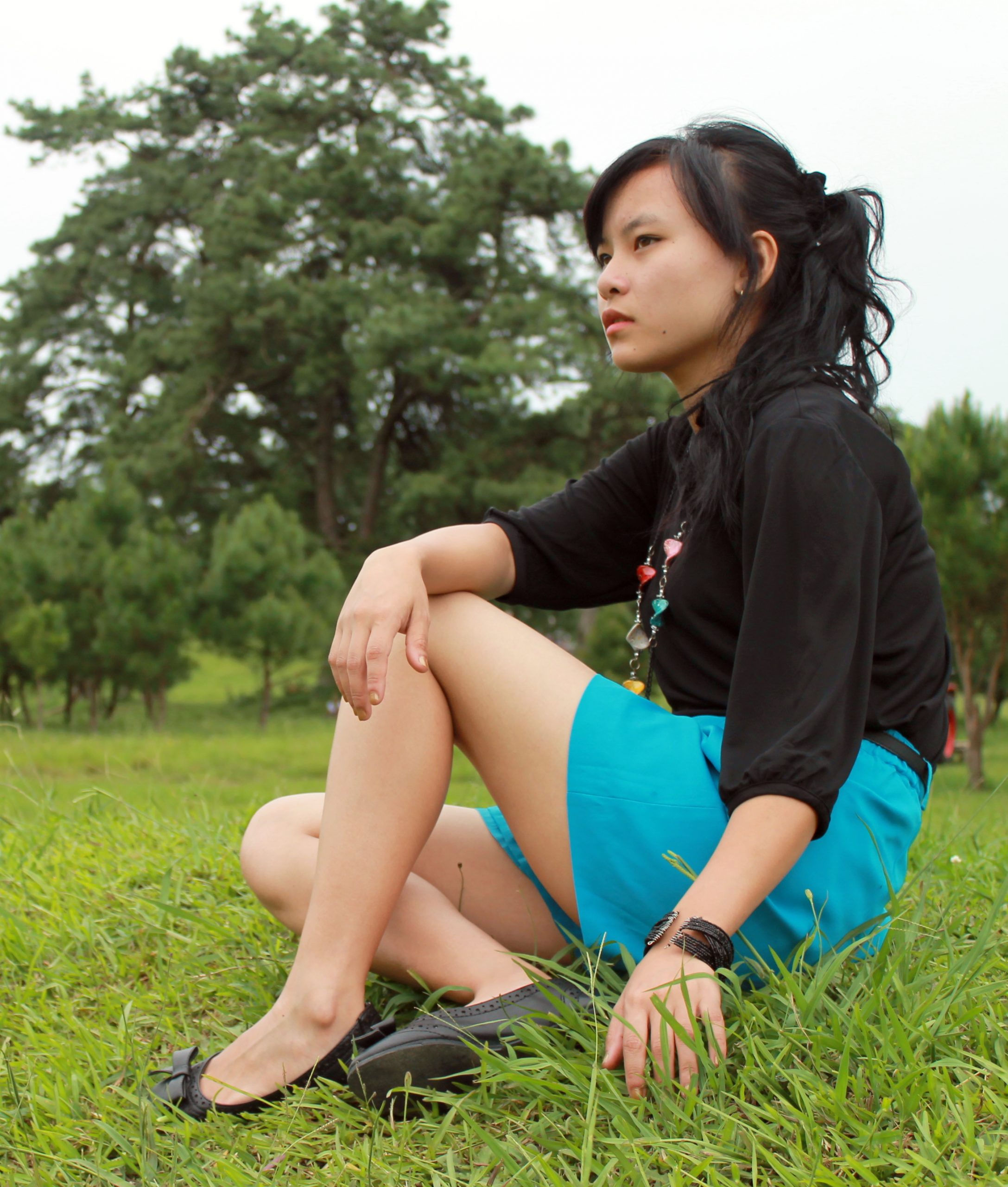 girl sitting on grass