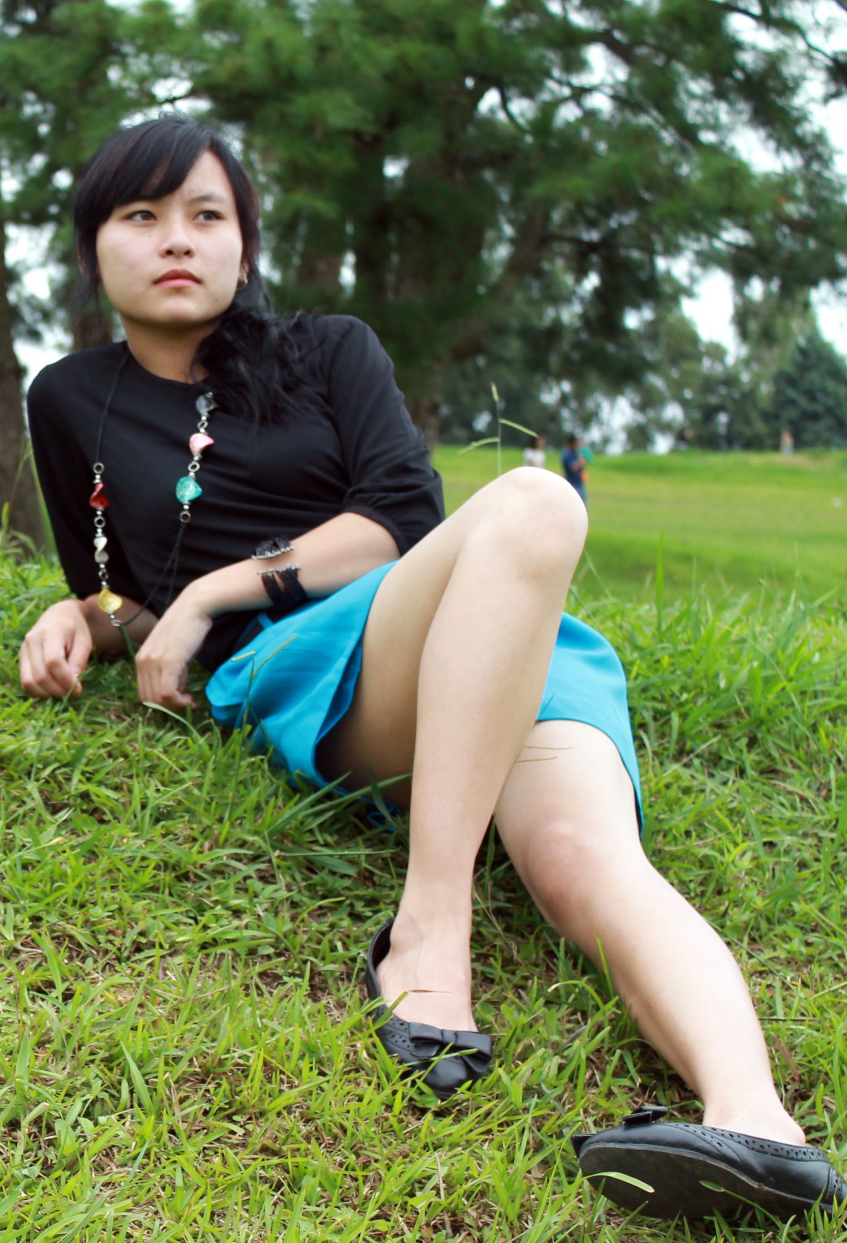 A girl laying on grass
