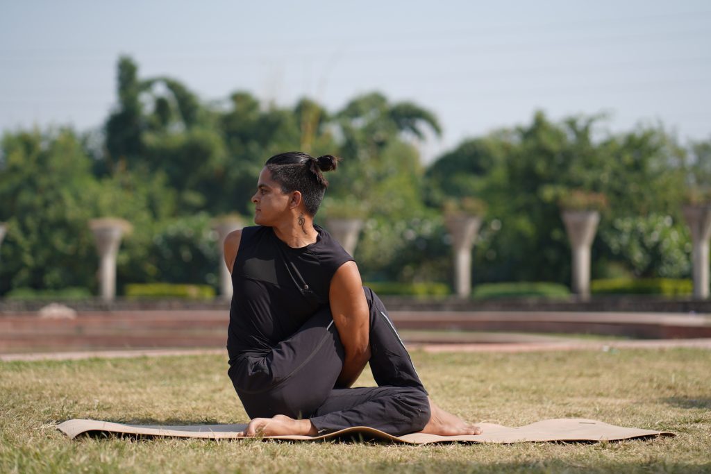 Premium Vector | Woman doing yoga asana half lord of the fishes pose or  ardha matsyendrasana