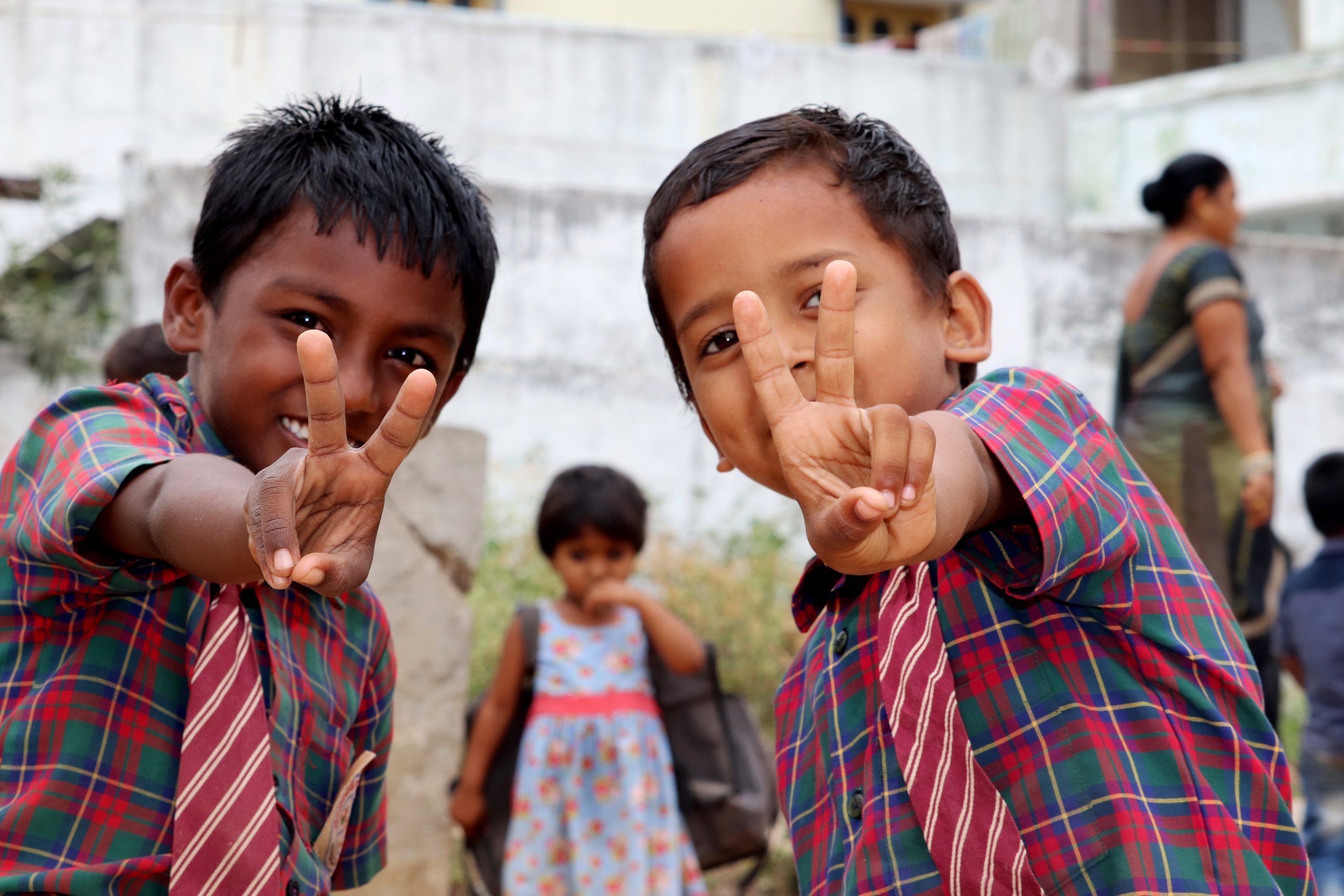 Happy kids showing victory sign