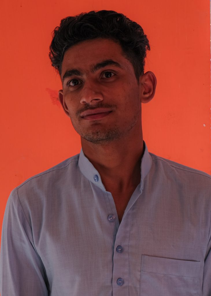 Indian boy with orange background - PixaHive