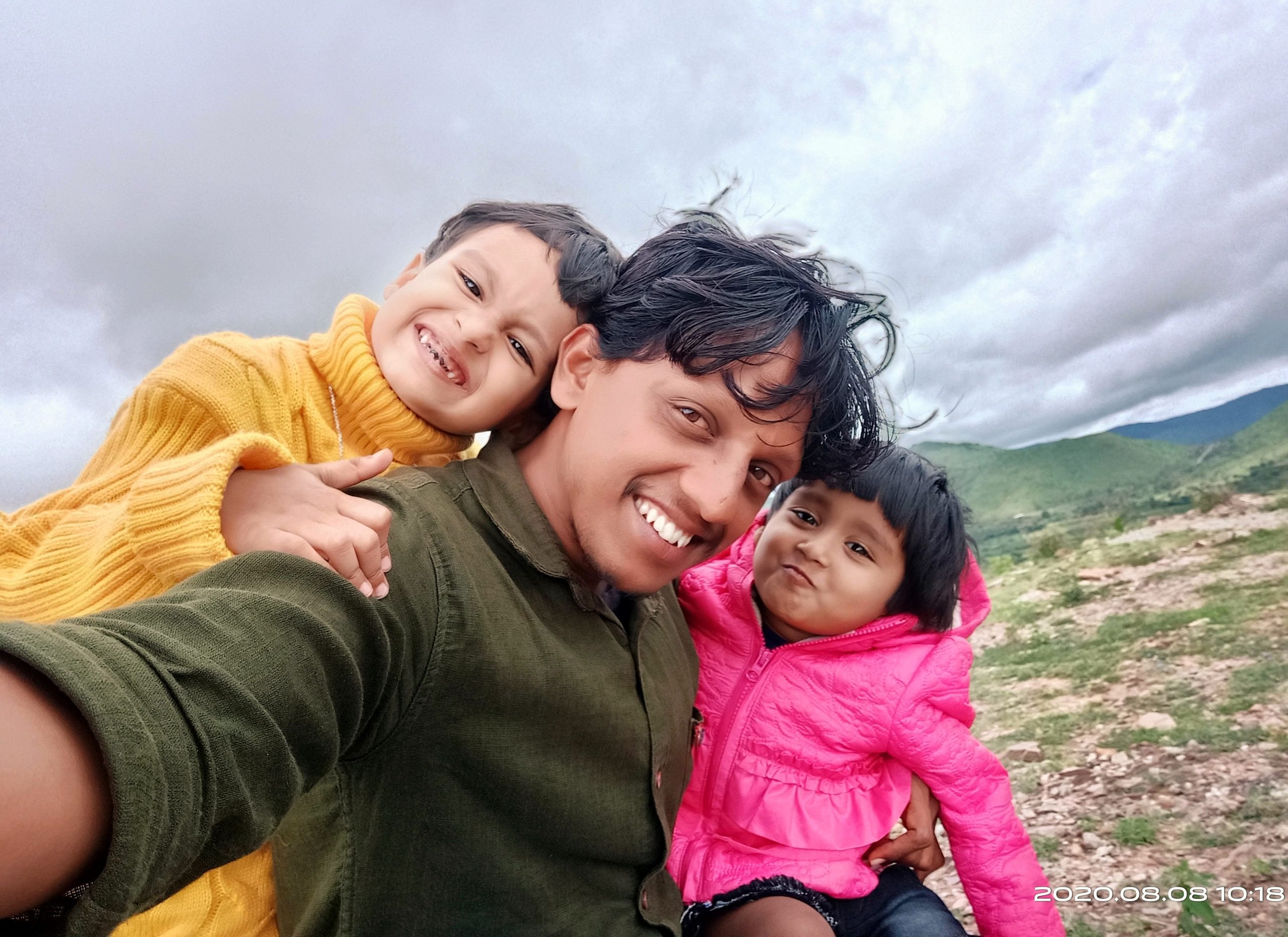Man taking selfie with his daughters