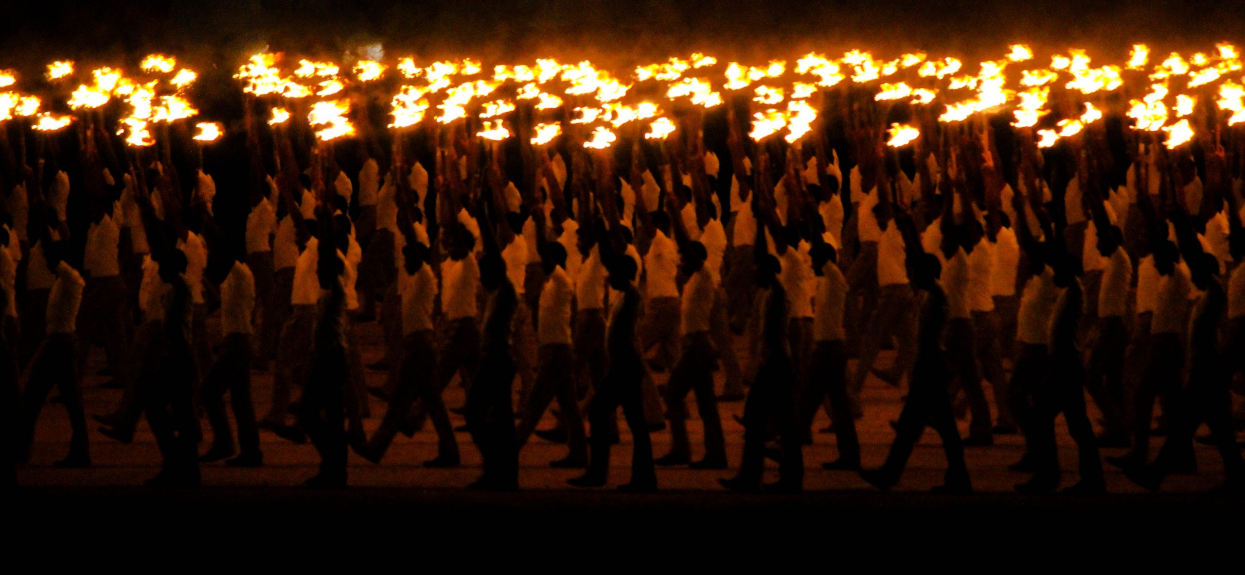 Men carrying firelights