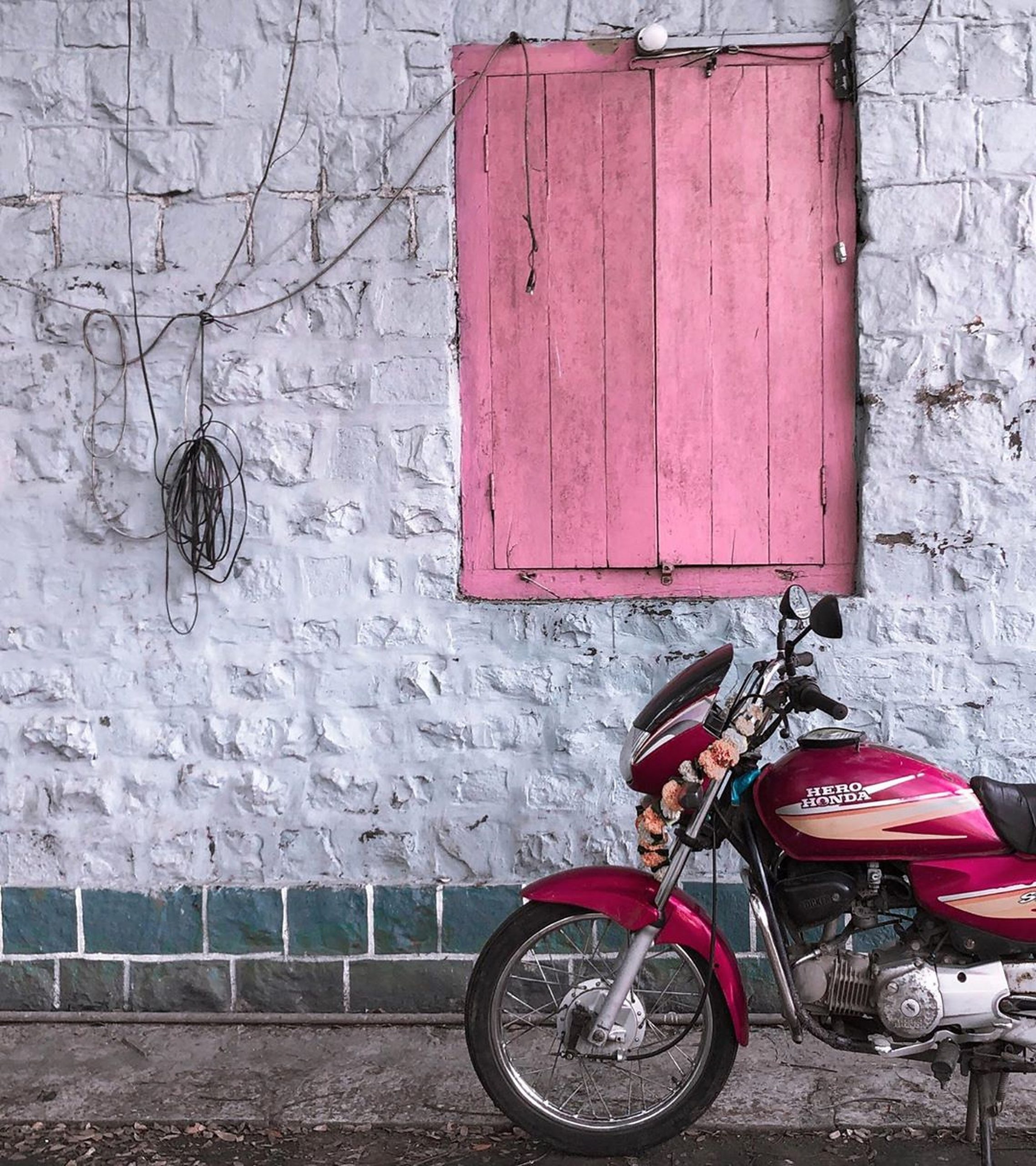 A motorbike near a wall