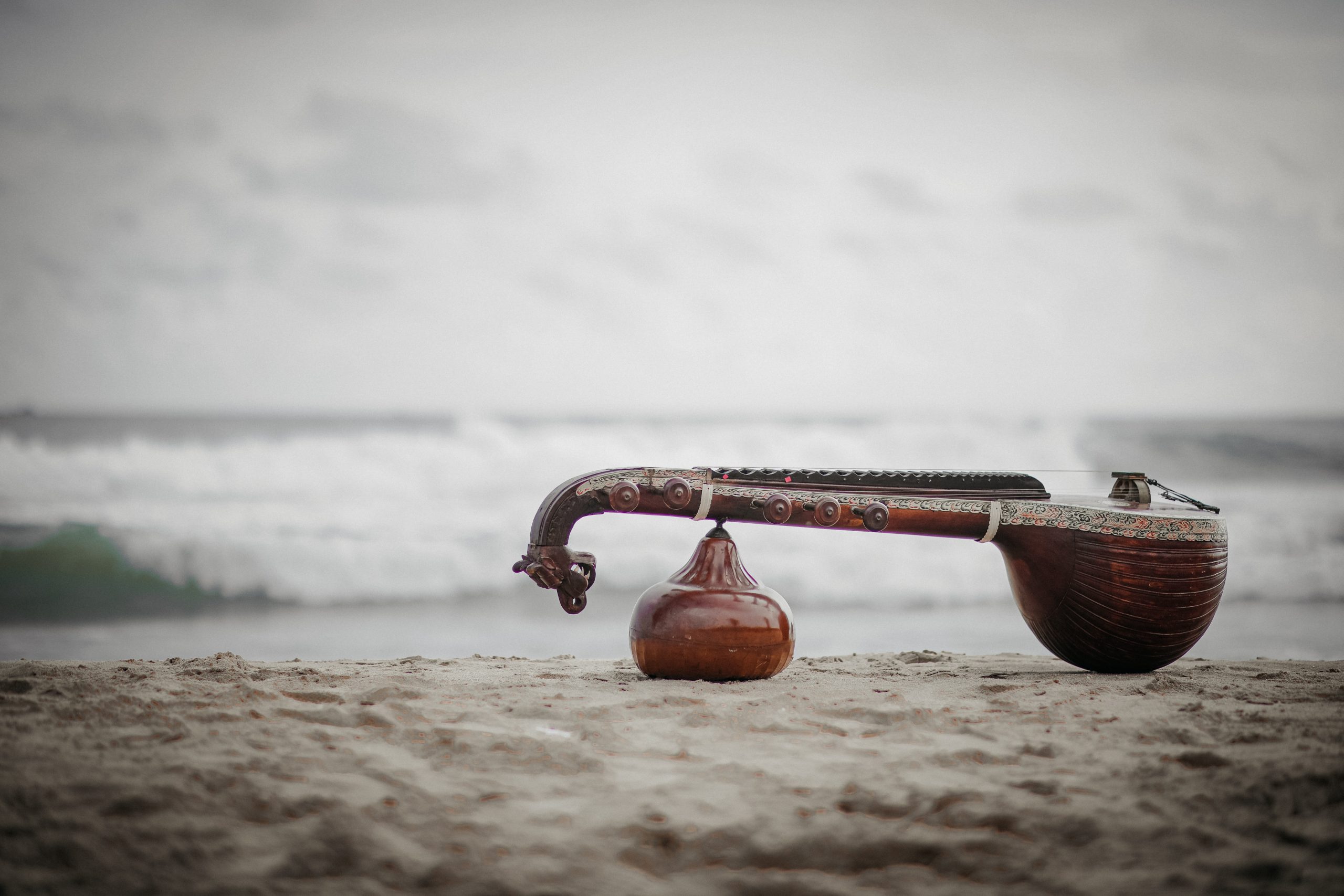 Musical Instrument Veena on a beach