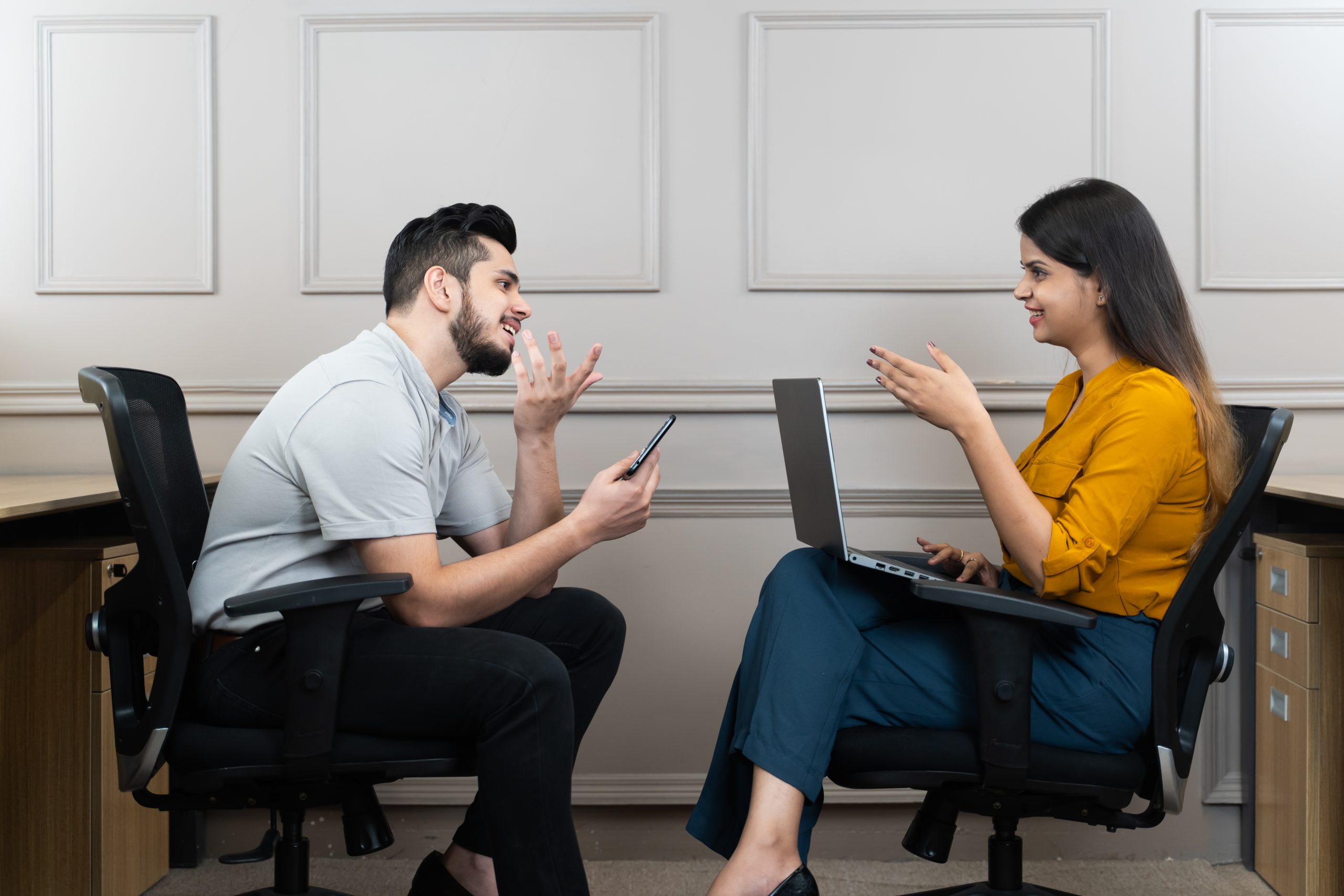 Office colleagues talking with each other