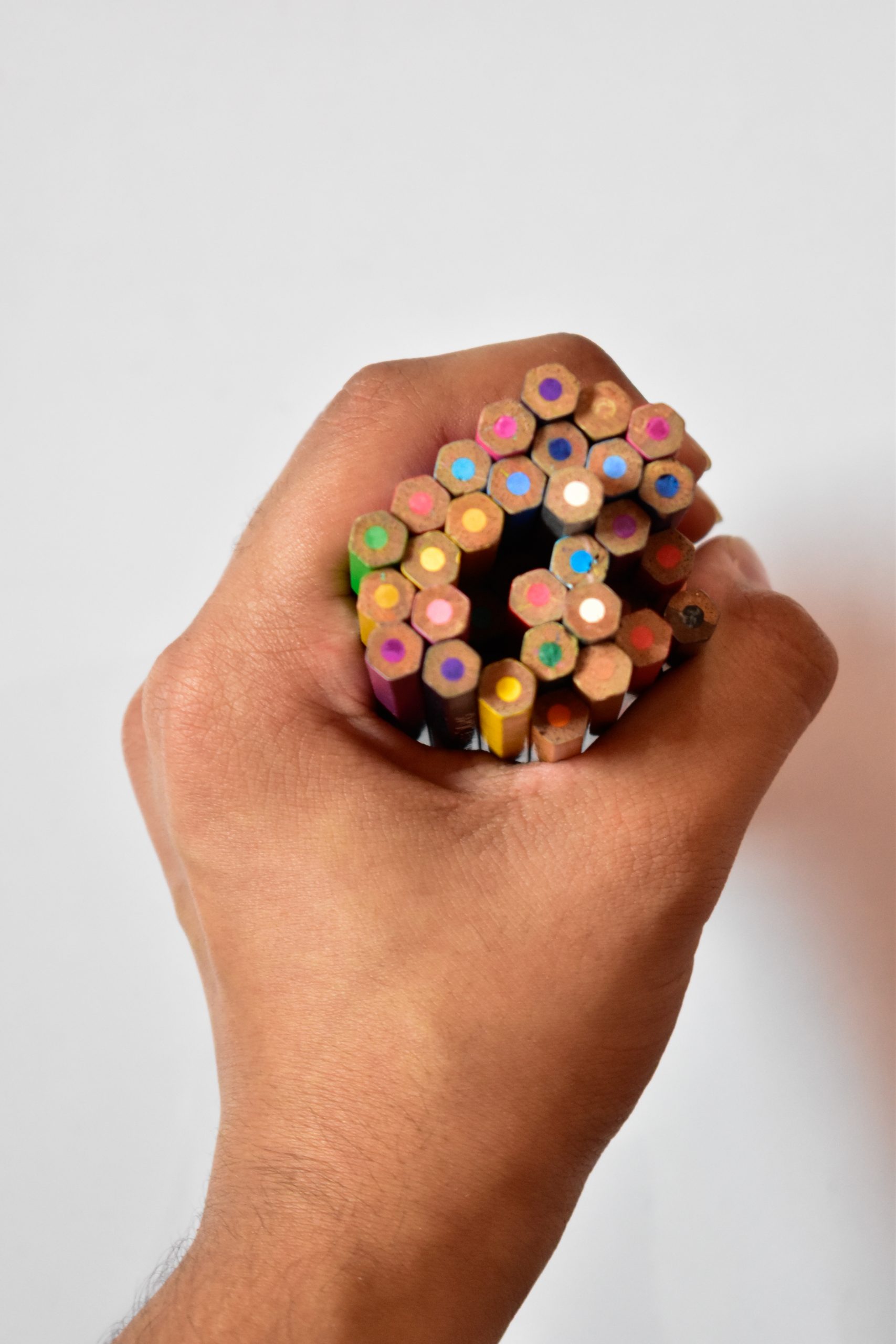 pencil colors in a hand