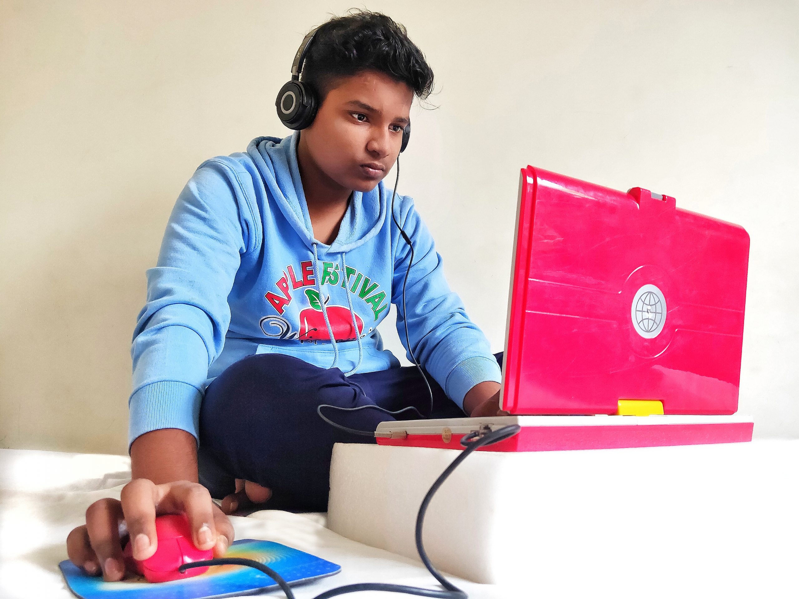 boy using laptop and headphones