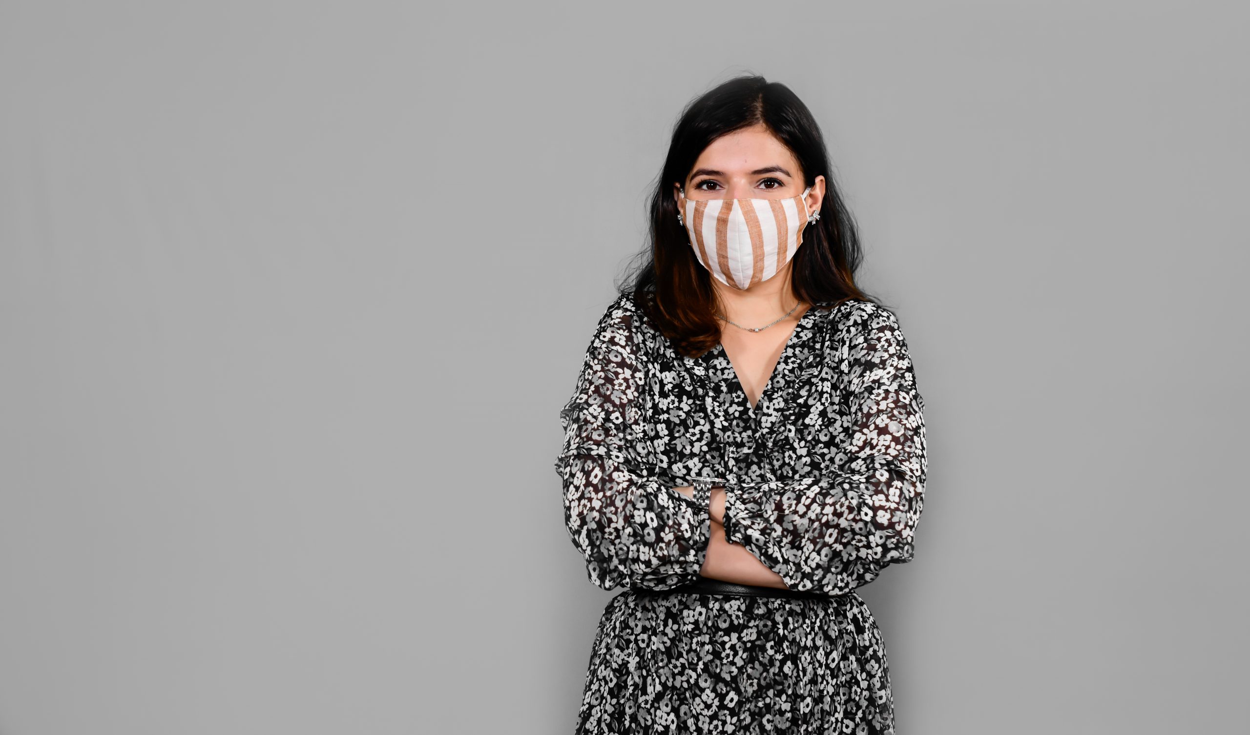 Portrait of woman in folded arms with Mask