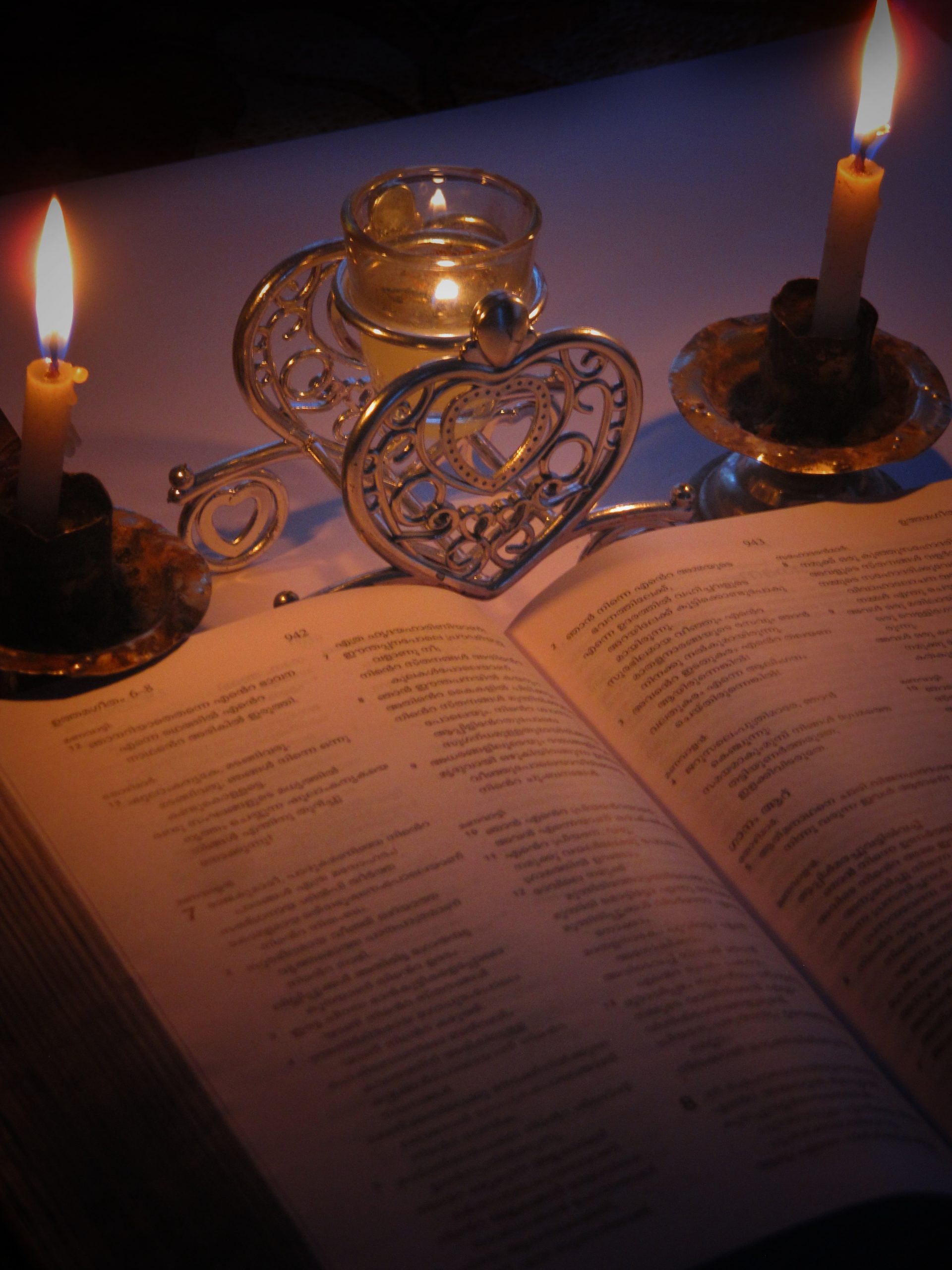 Reading Bible in candle light