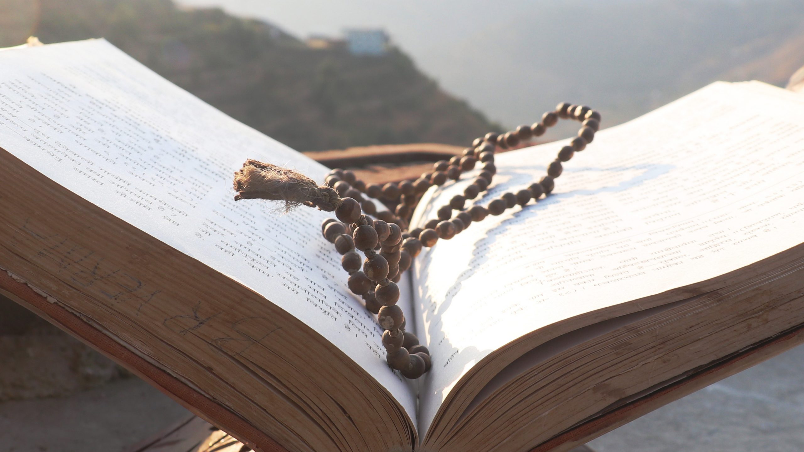 religious book and beads