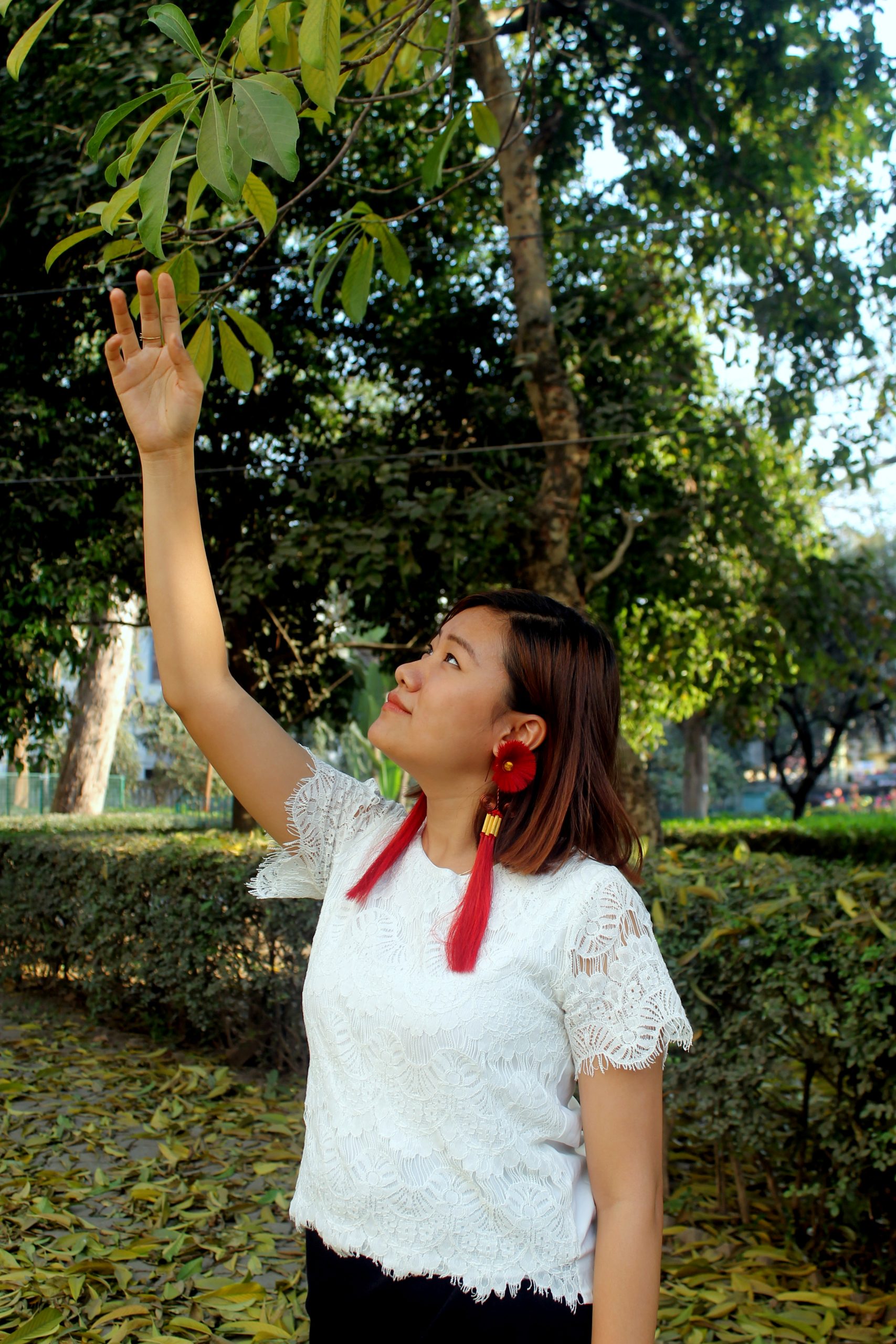 girl touching leaves