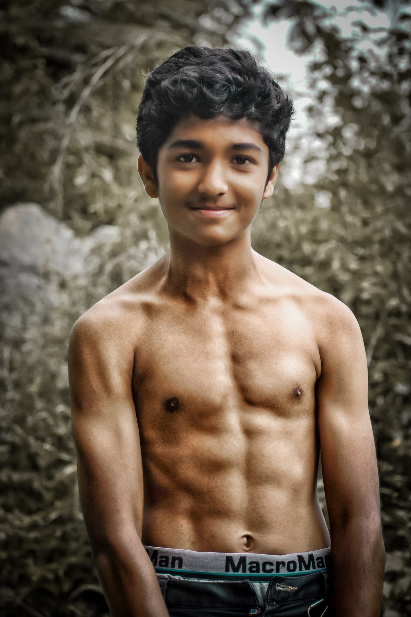 Young boy posing bare chested