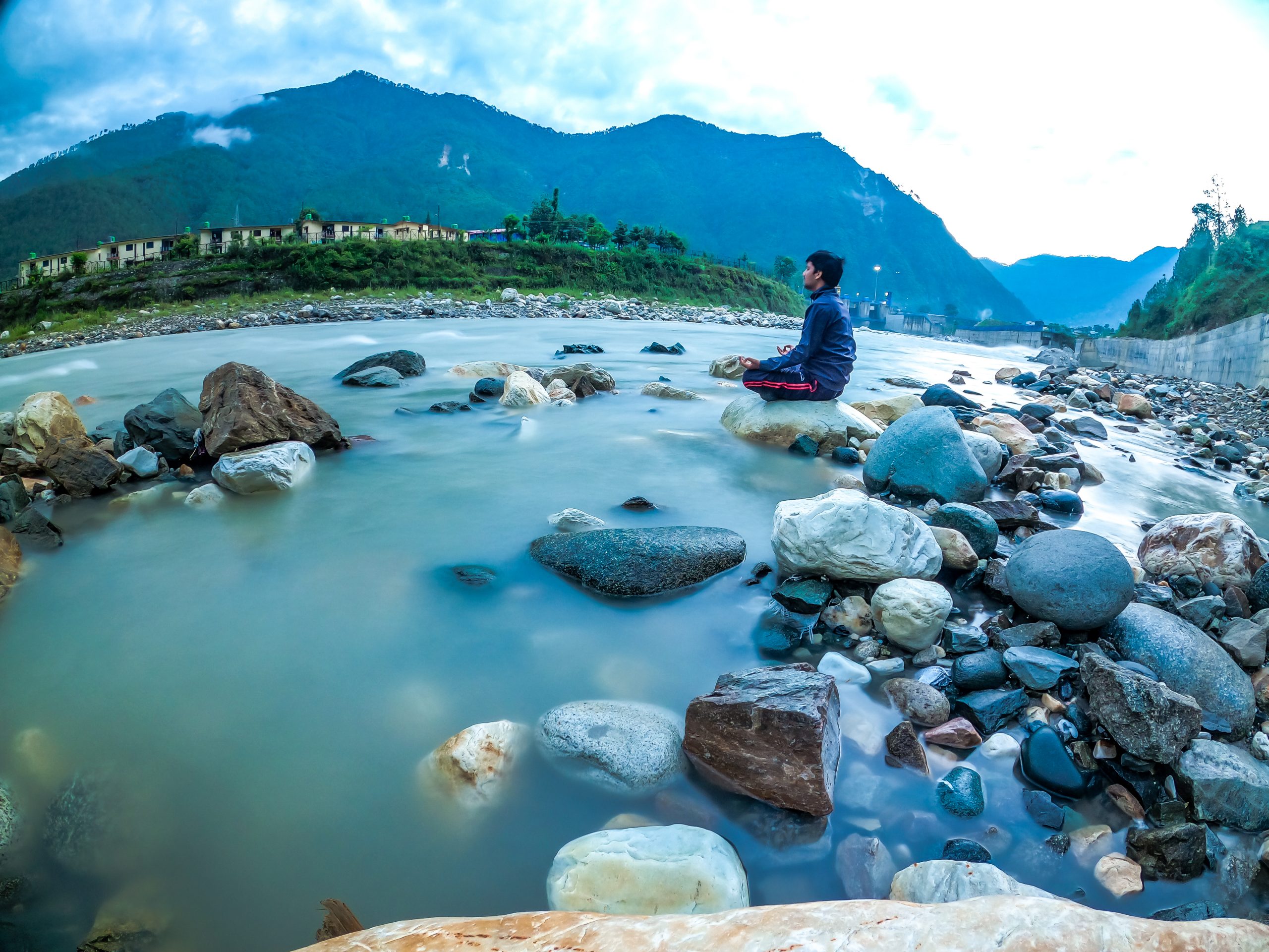 Yoga on a rocky river