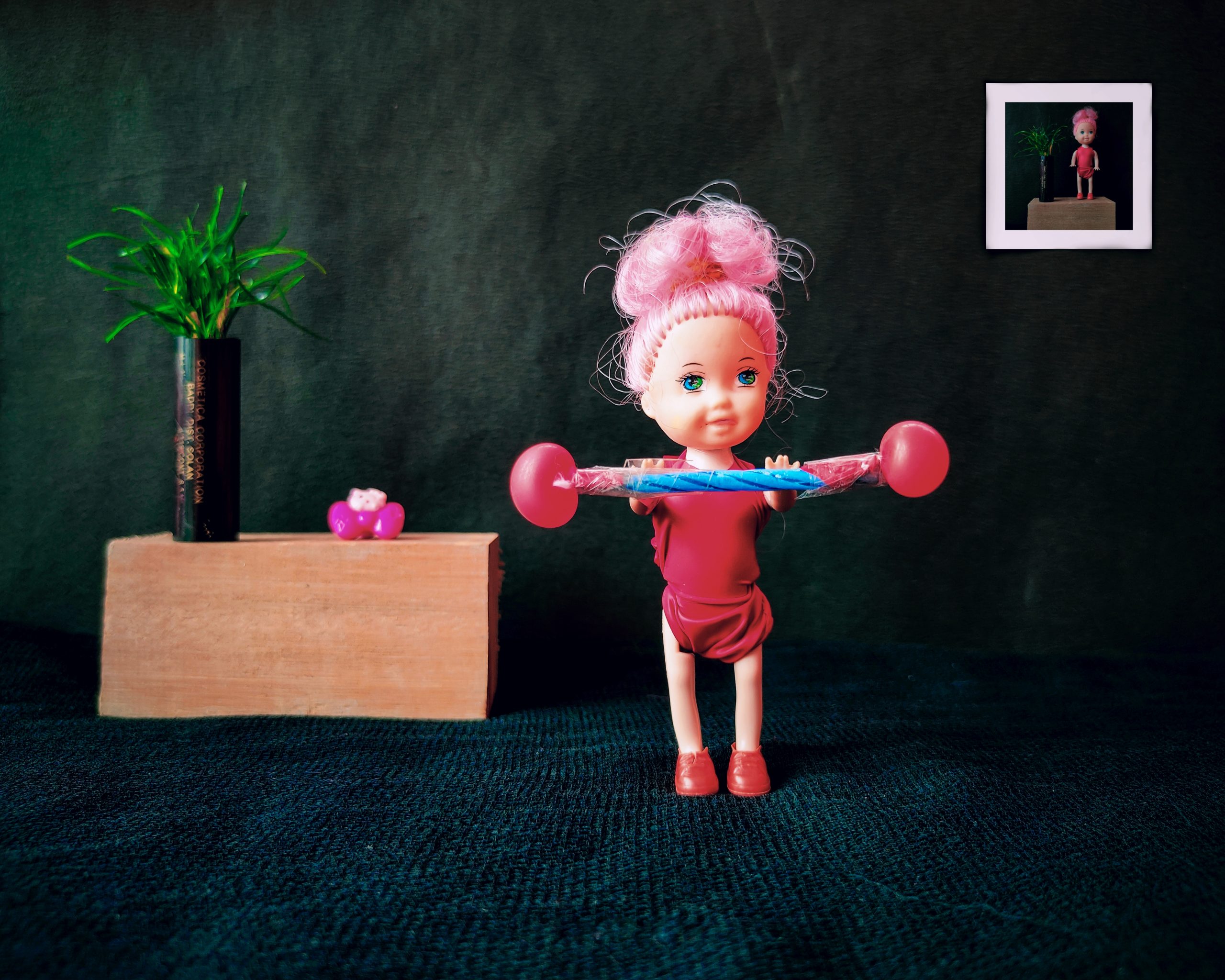 A doll lifting weight