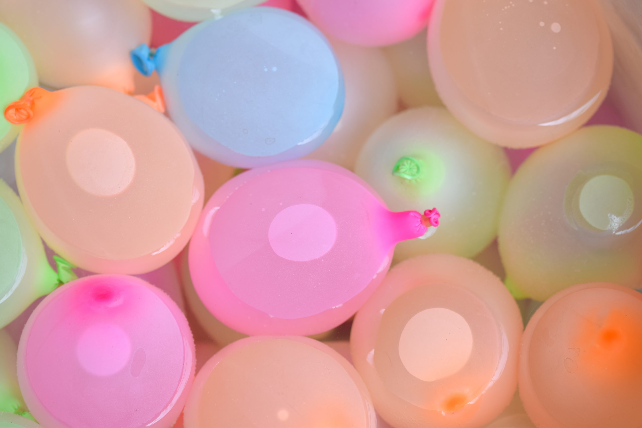 Water balloons in a water tub.
