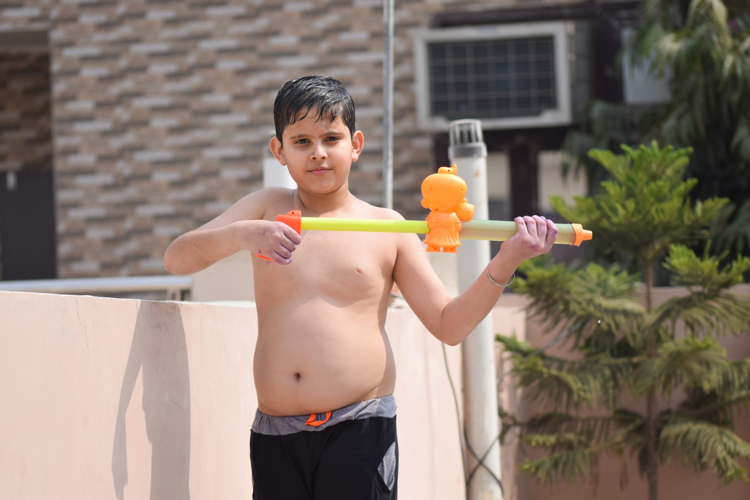 A little boy with water gun