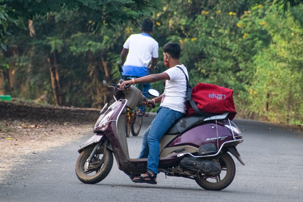 A delivery boy on a scooter PixaHive