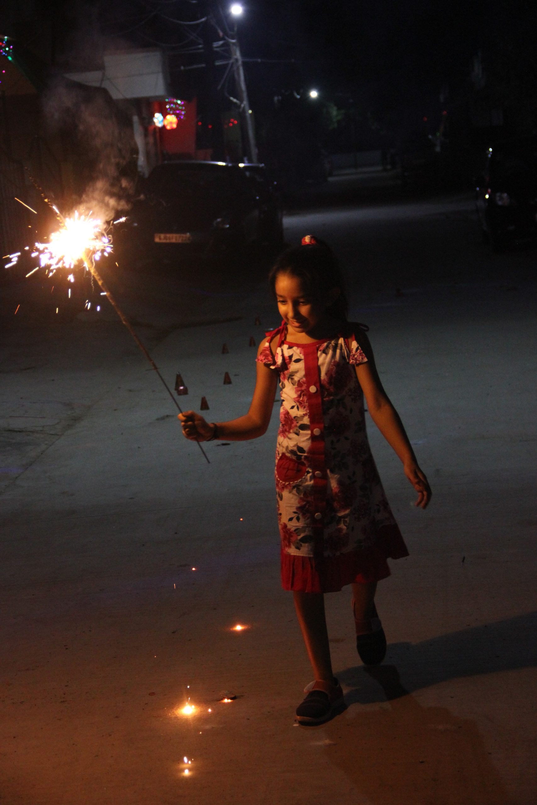 A little girl cracking sparklers