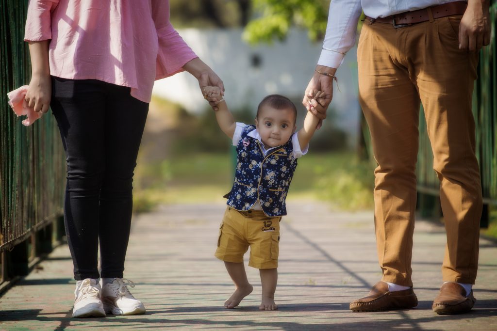 A little kid walking with parents - Free Image by Abhinav Thakur on
