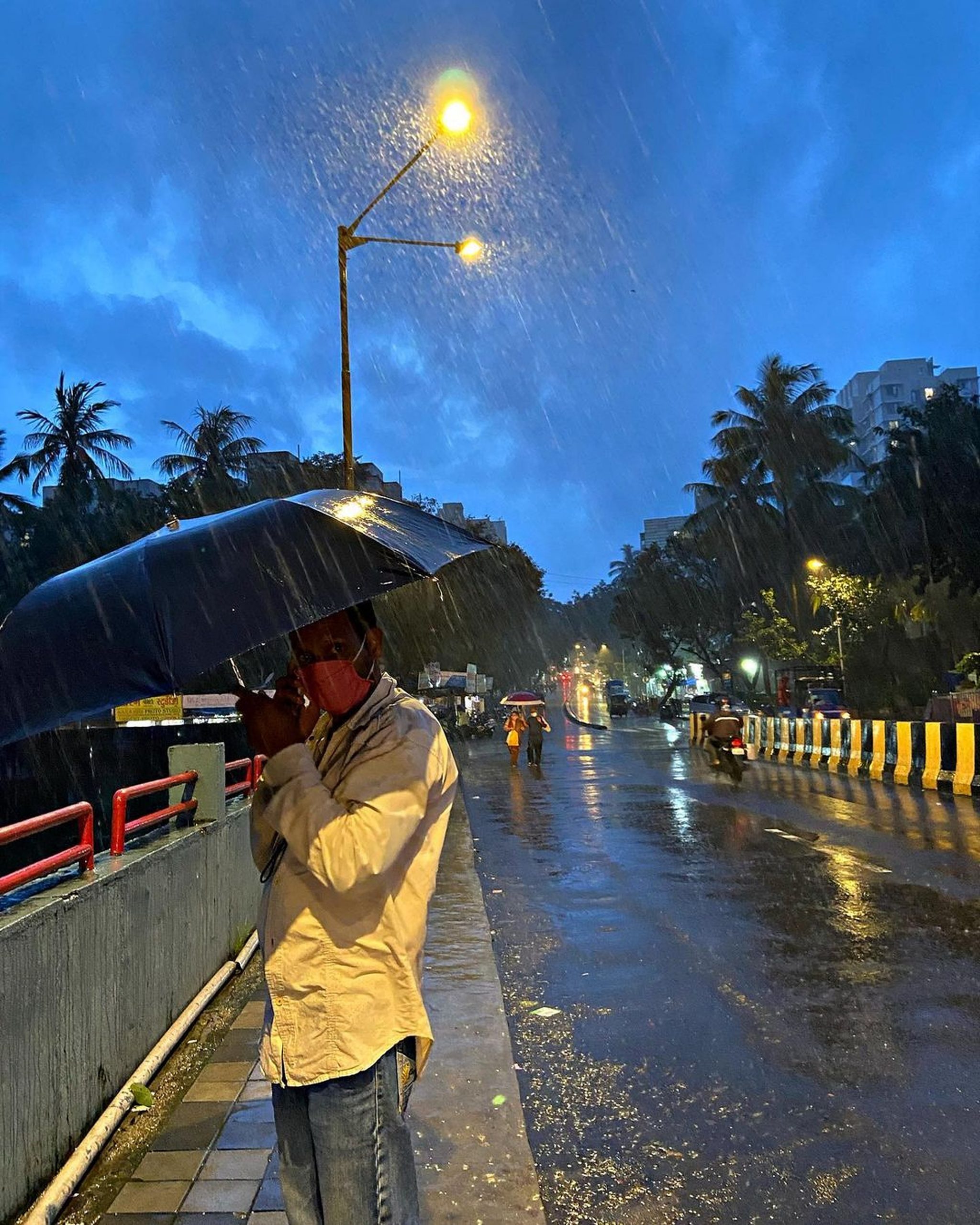 A man with umbrella in rain