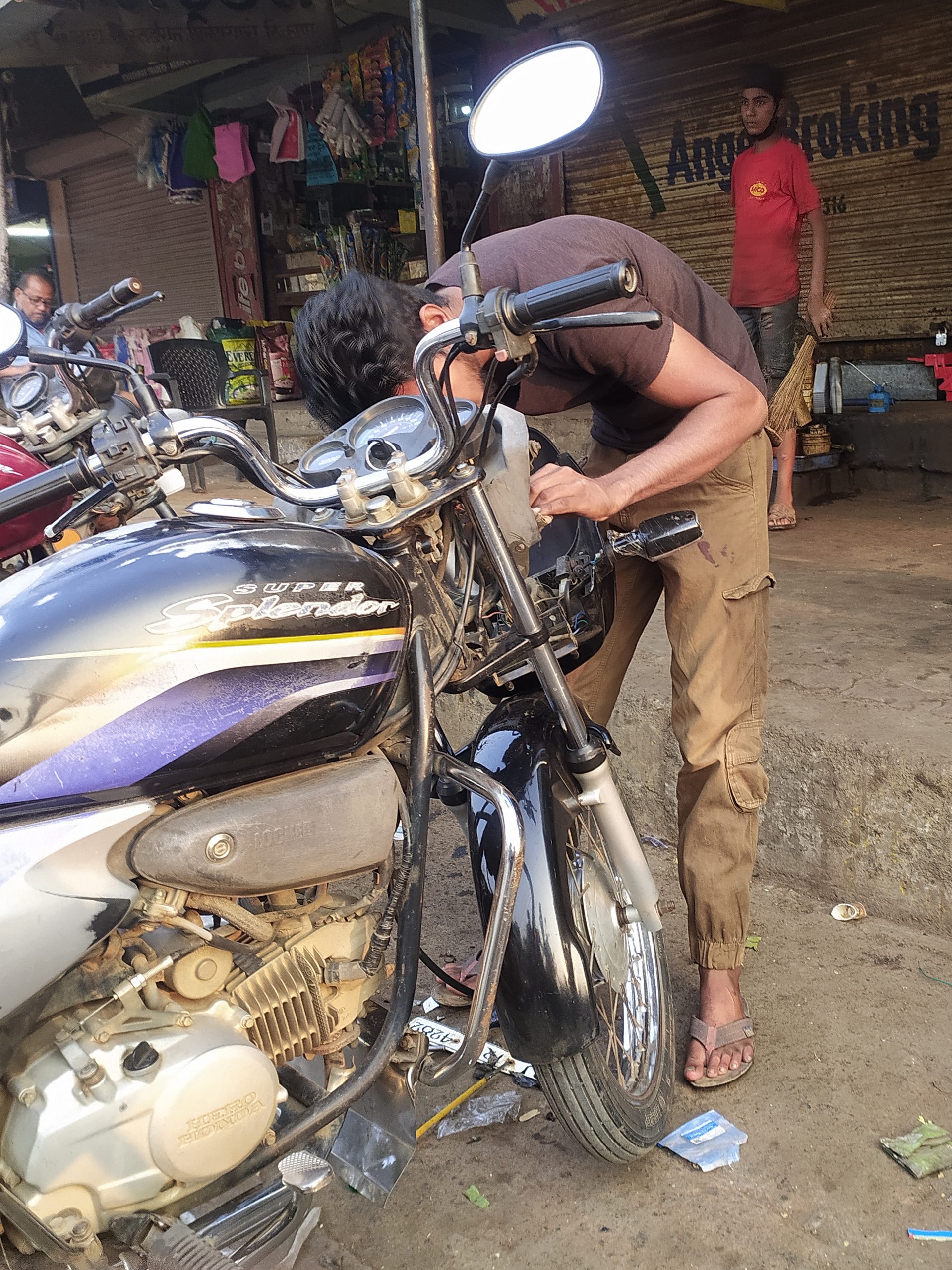 A mechanic repairing a bike