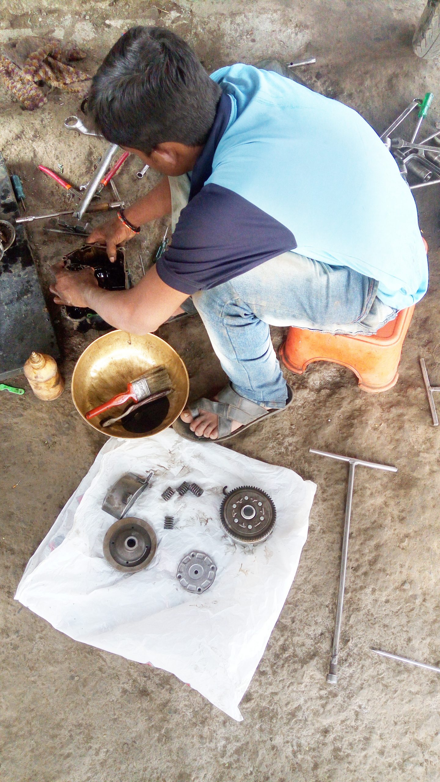 A mechanic working with tools