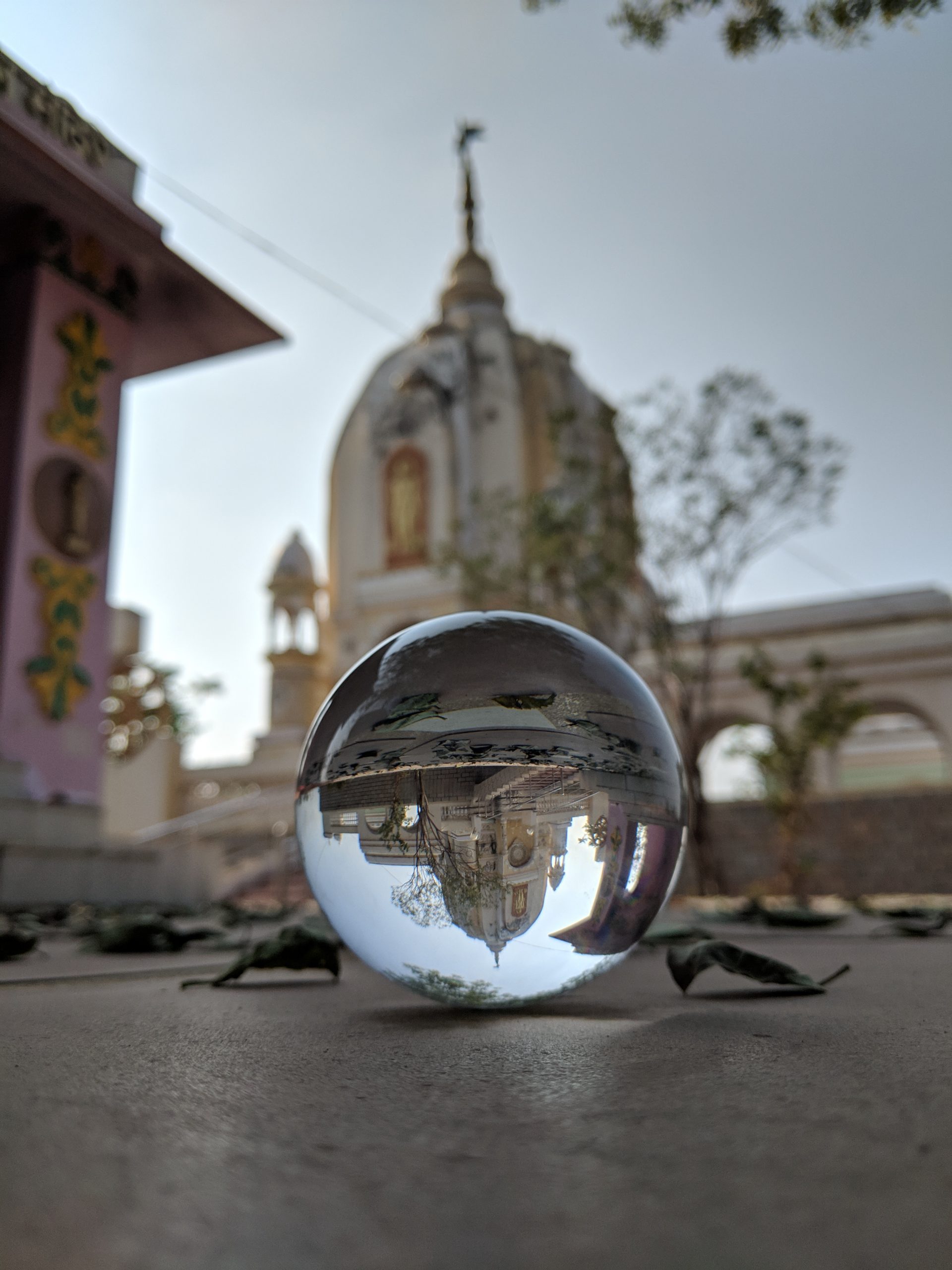 A reflection of a temple in a lensball