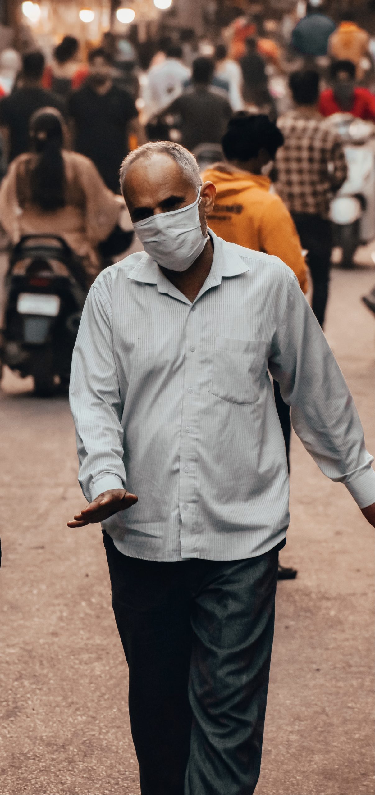 An old man walking in a street