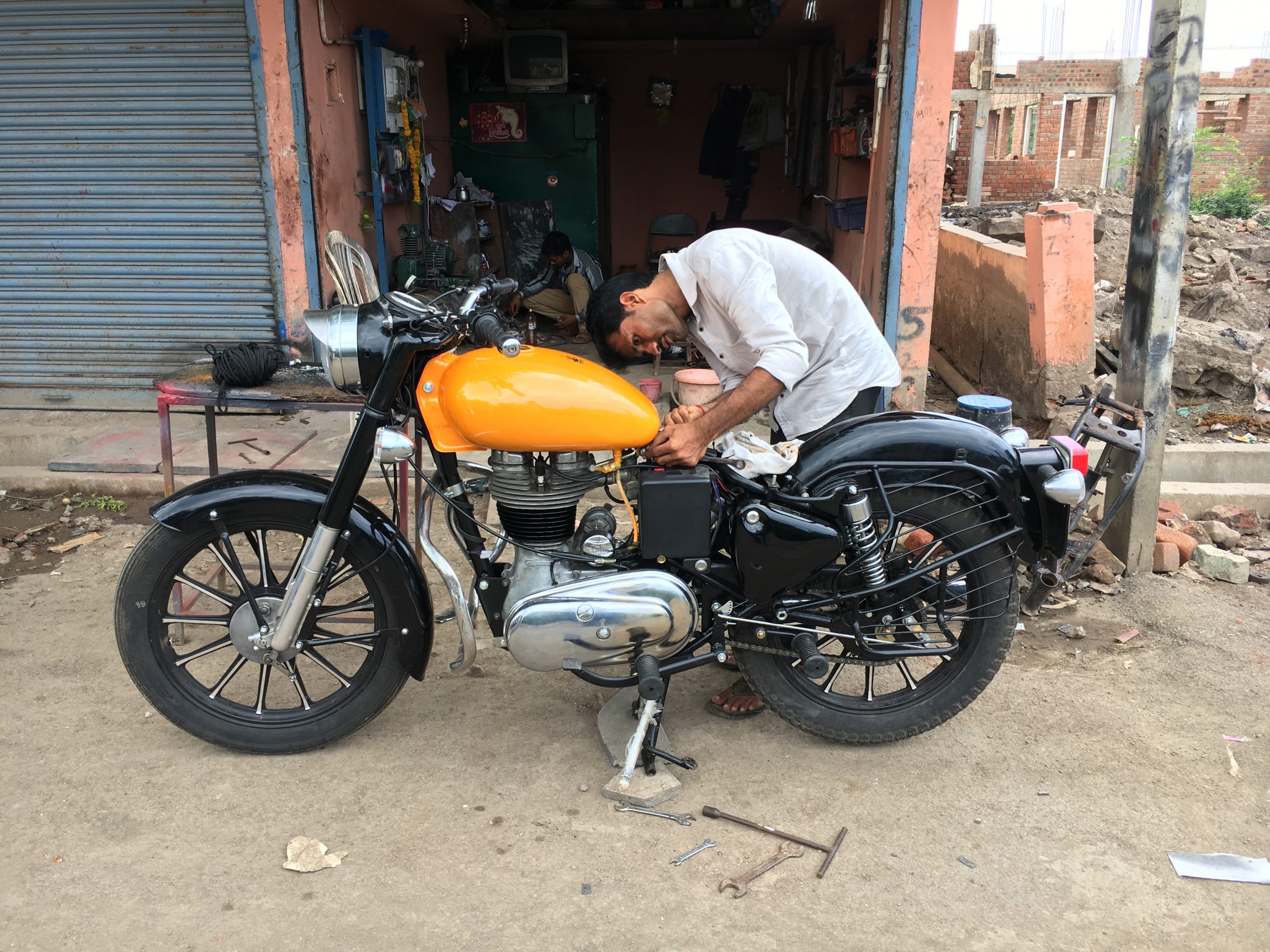 mechanic repairing bike